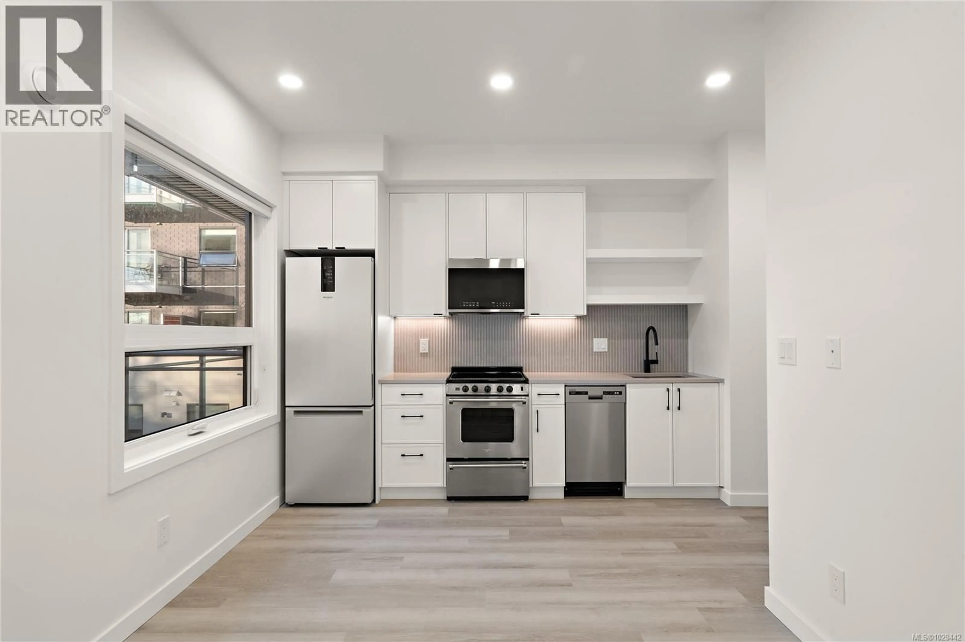 Open concept kitchen, unknown for 205 - 1102 ESQUIMALT ROAD, Esquimalt British Columbia V9A0L3