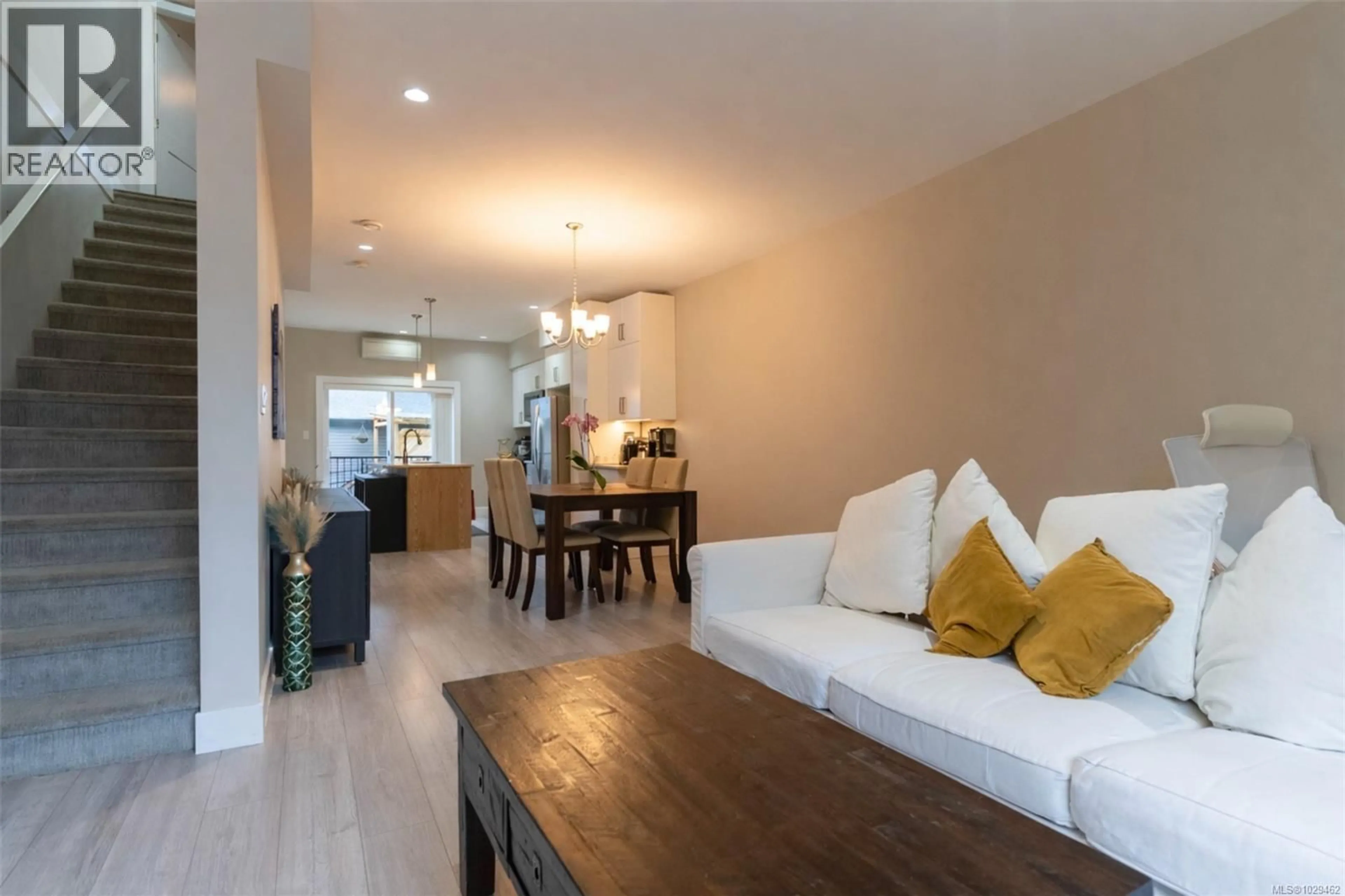 Living room with furniture, wood/laminate floor for 107 - 933 WILD RIDGE WAY, Langford British Columbia V9C0H1