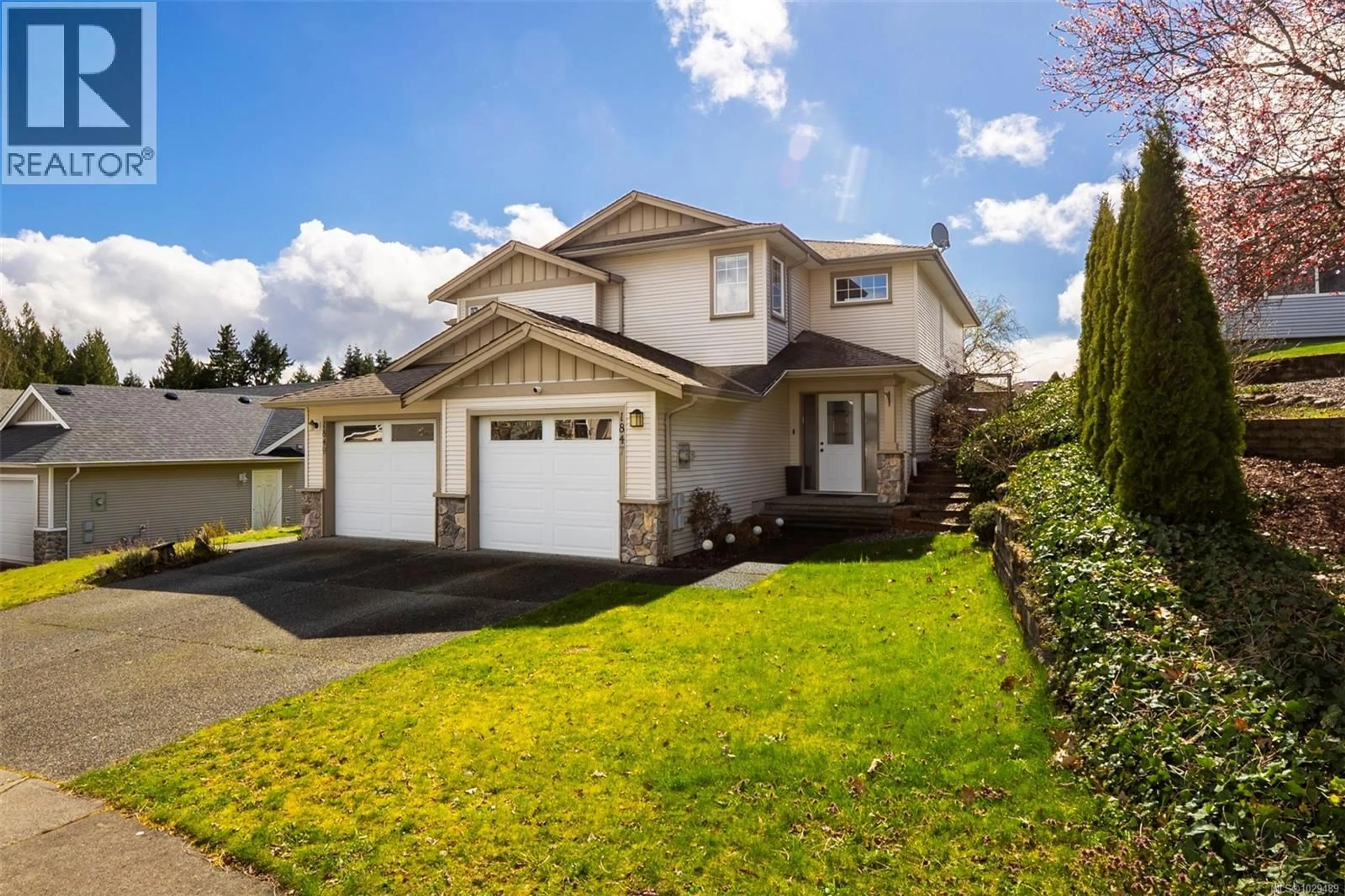 Home with vinyl exterior material, street for 1847 WHITE BLOSSOM WAY, Nanaimo British Columbia V9X1X7