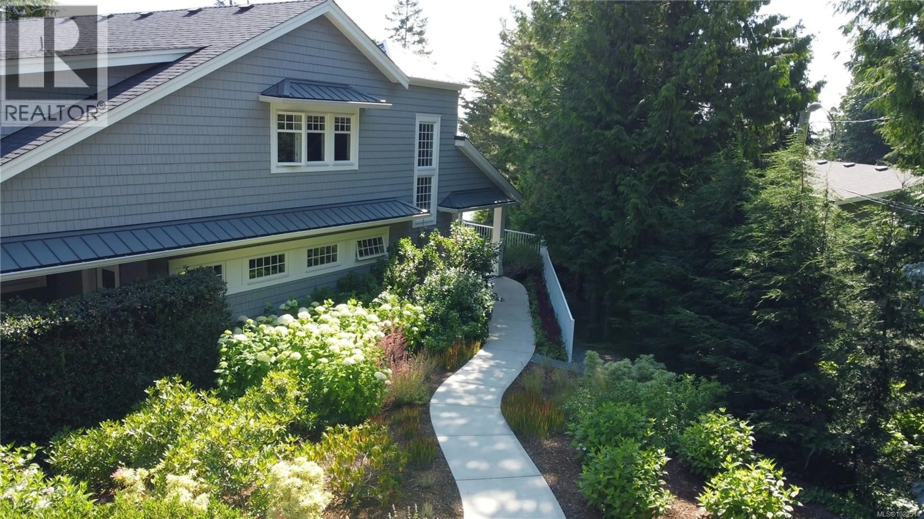 A pic from outside/outdoor area/front of a property/back of a property/a pic from drone, street for 8401 LOCHSIDE DRIVE, Central Saanich British Columbia V8M1T9