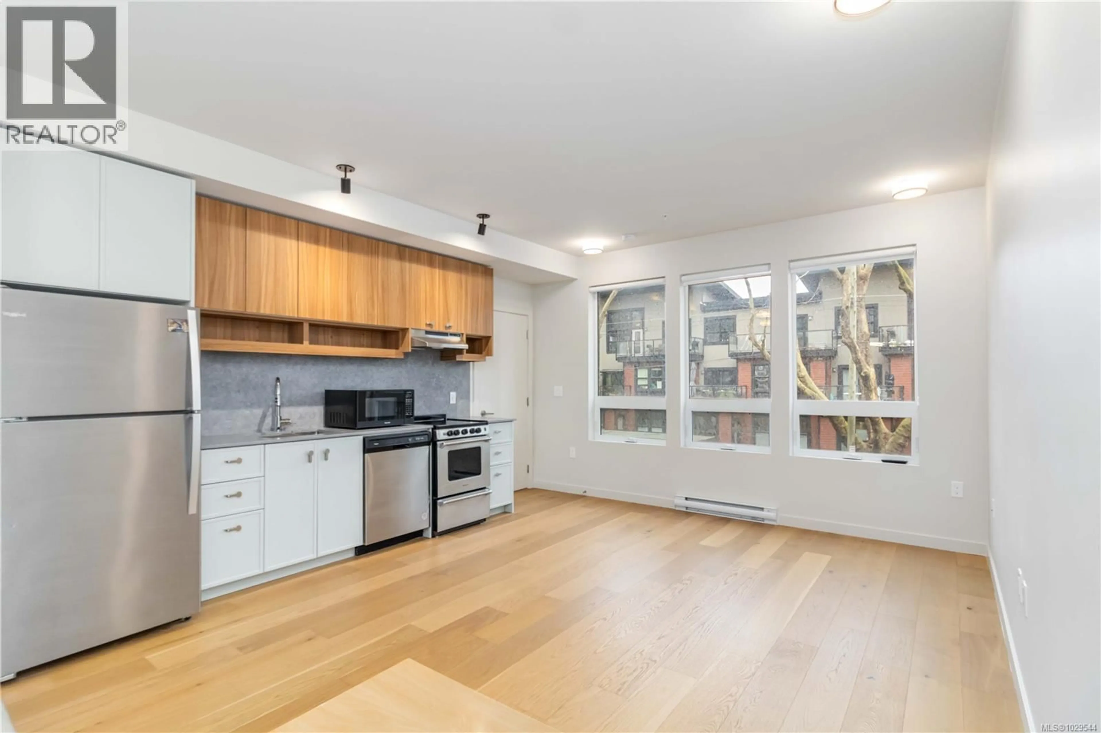 Open concept kitchen, wood/laminate floor for 202 - 629 SPEED AVENUE, Victoria British Columbia V8Z1A5