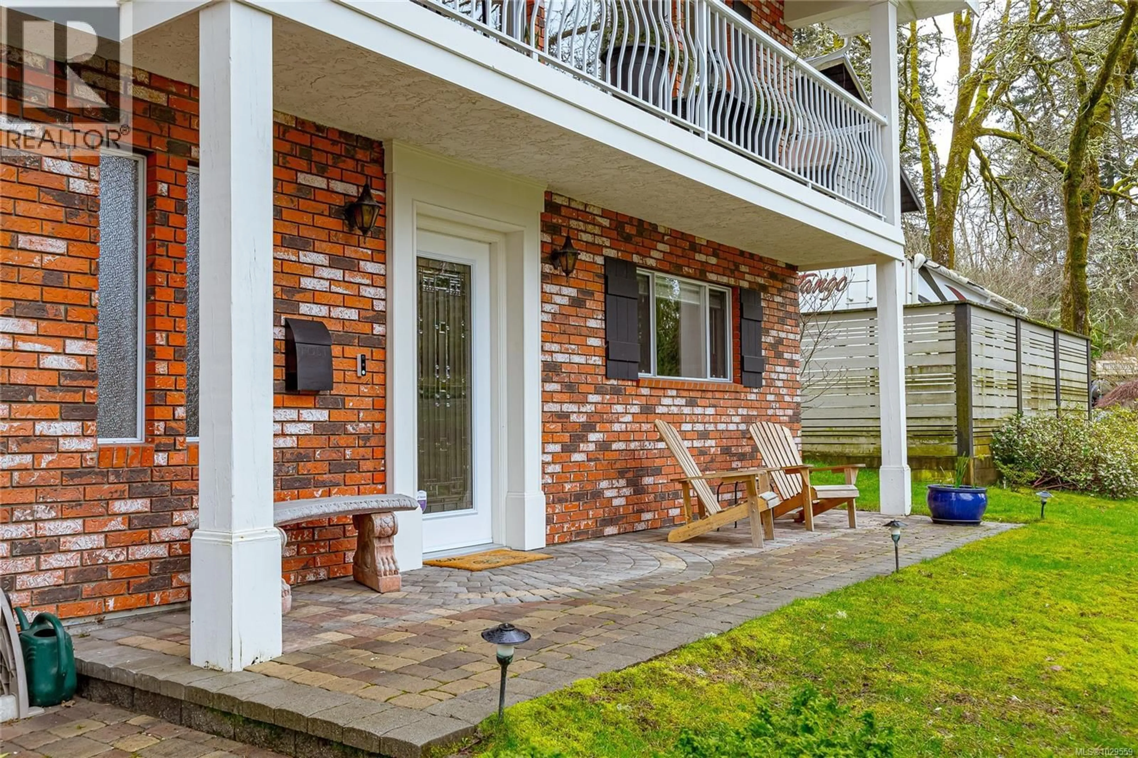 Home with brick exterior material, street for 920 WOODHALL DRIVE, Saanich British Columbia V8X3L8