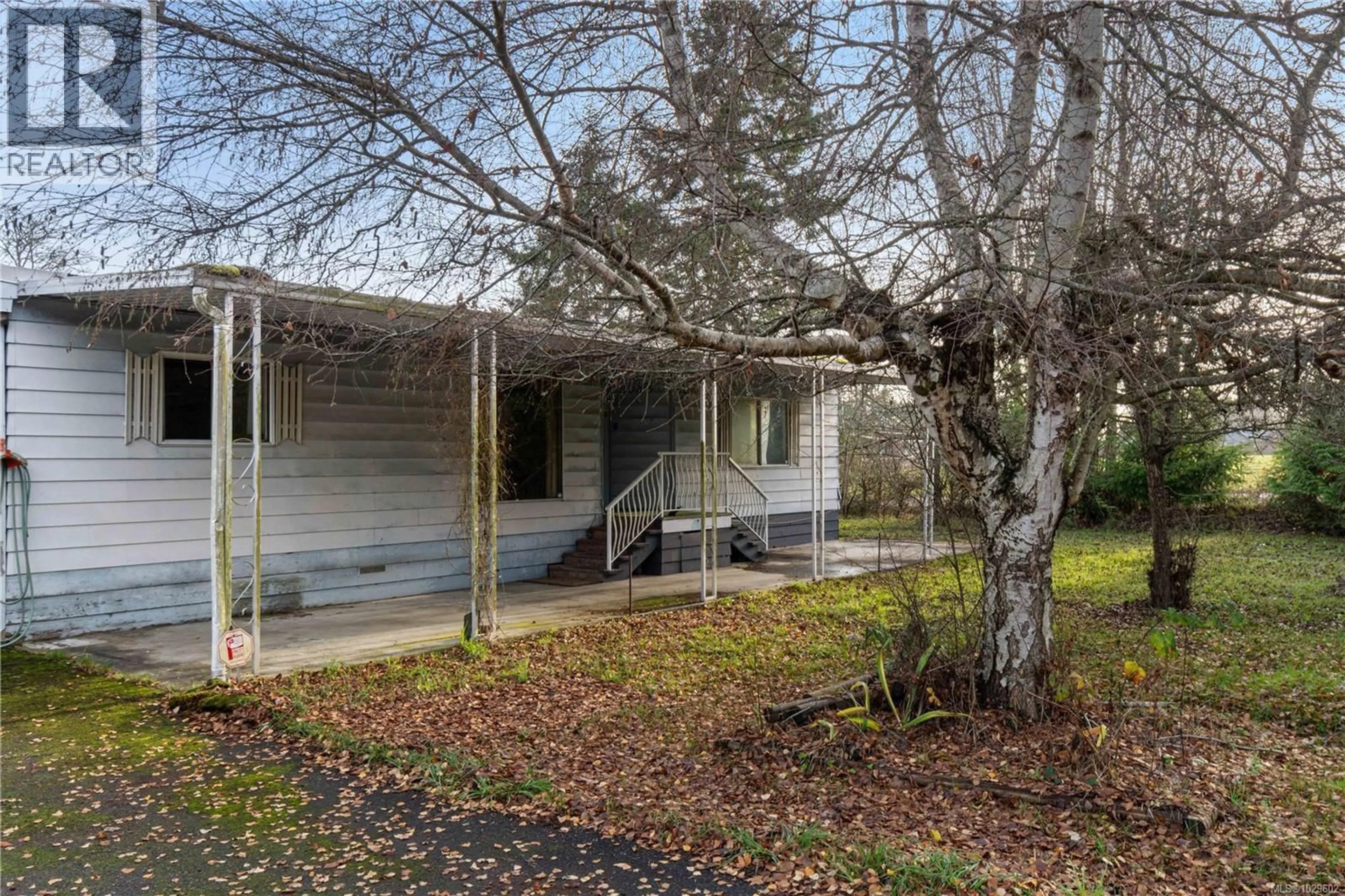 Home with vinyl exterior material, street for 792 REID ROAD, Parksville British Columbia V9P2E6