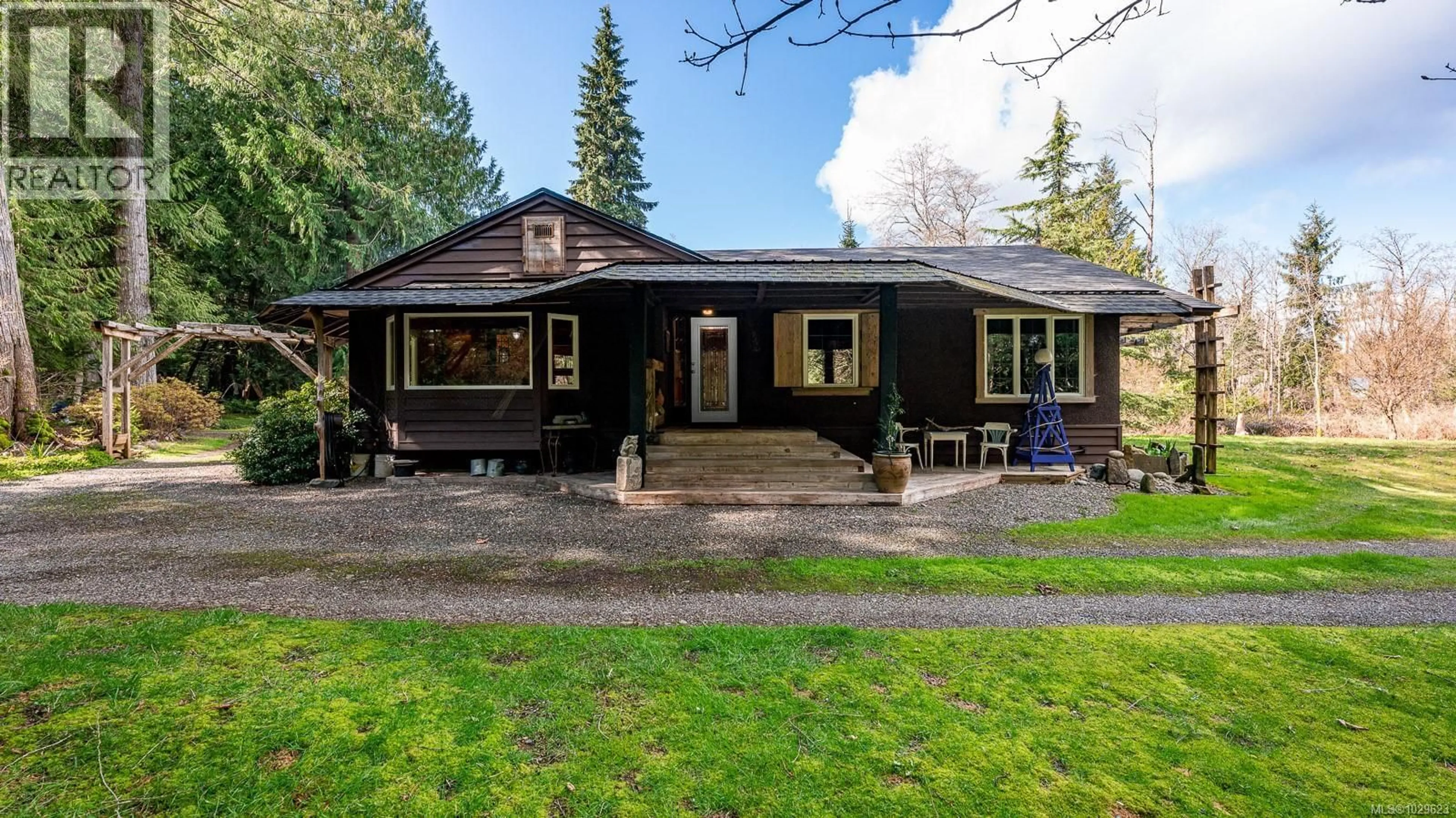 A pic from outside/outdoor area/front of a property/back of a property/a pic from drone, street for 8131 MACARTNEY DRIVE, Fanny Bay British Columbia V0R1W0