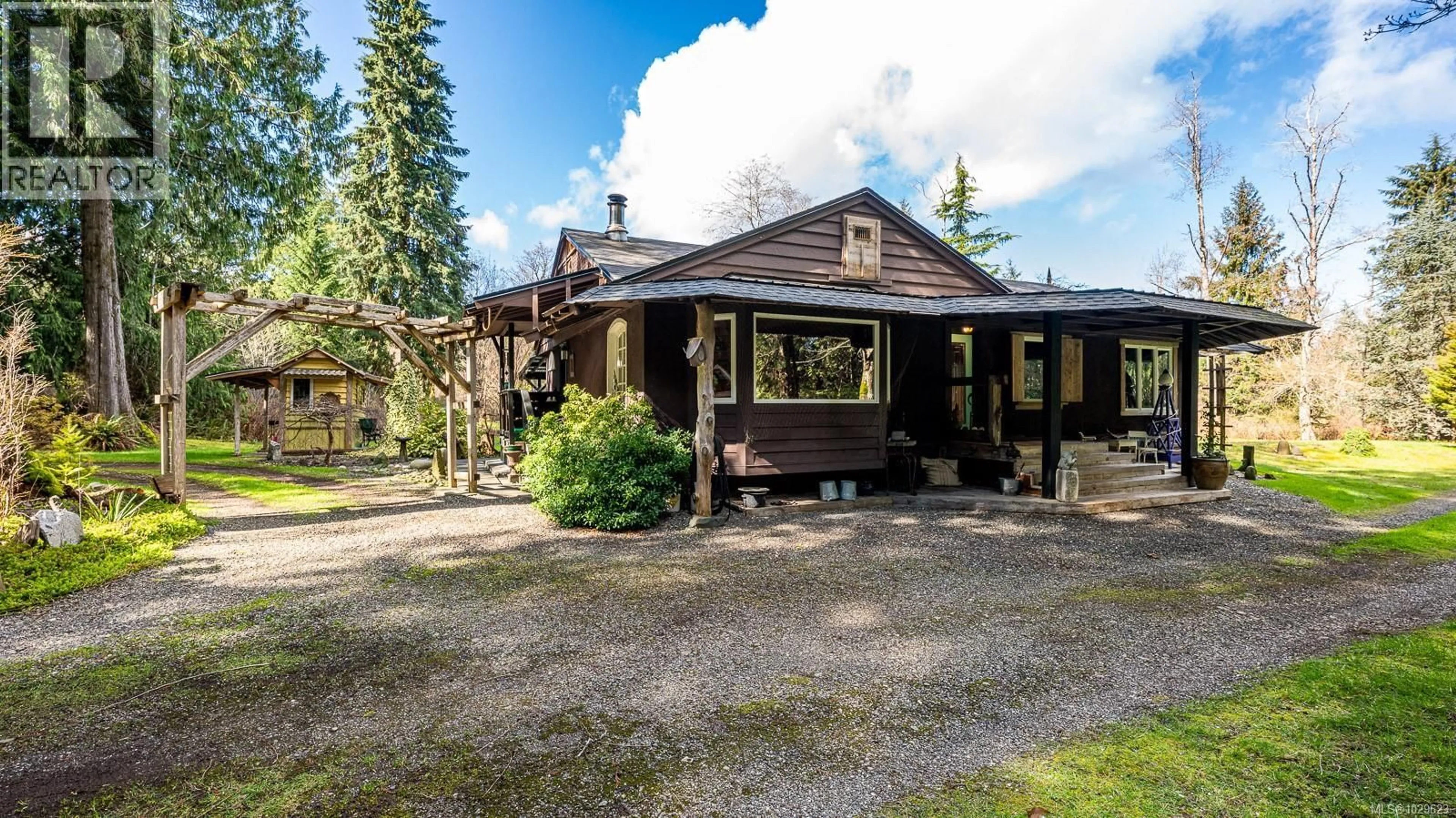 A pic from outside/outdoor area/front of a property/back of a property/a pic from drone, street for 8131 MACARTNEY DRIVE, Fanny Bay British Columbia V0R1W0