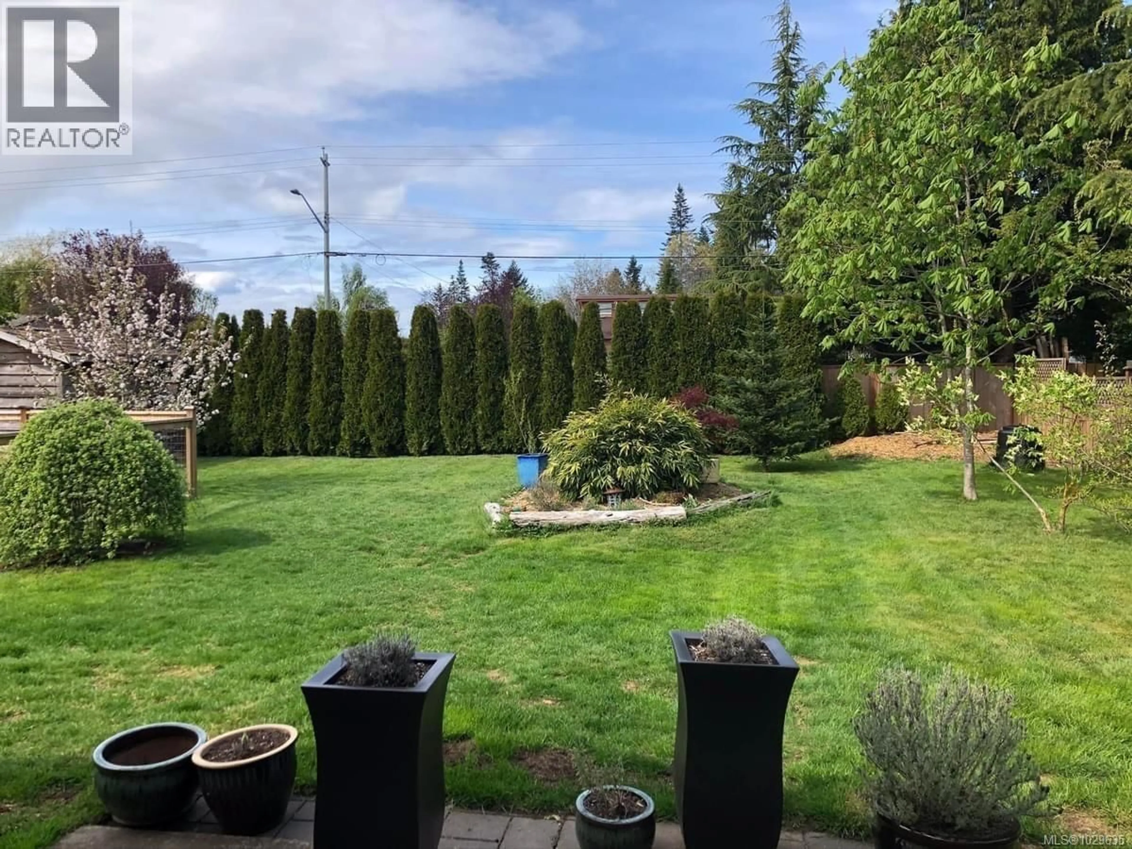 A pic from outside/outdoor area/front of a property/back of a property/a pic from drone, forest/trees view for 1646 MAQUINNA AVENUE, Comox British Columbia V9M3L7