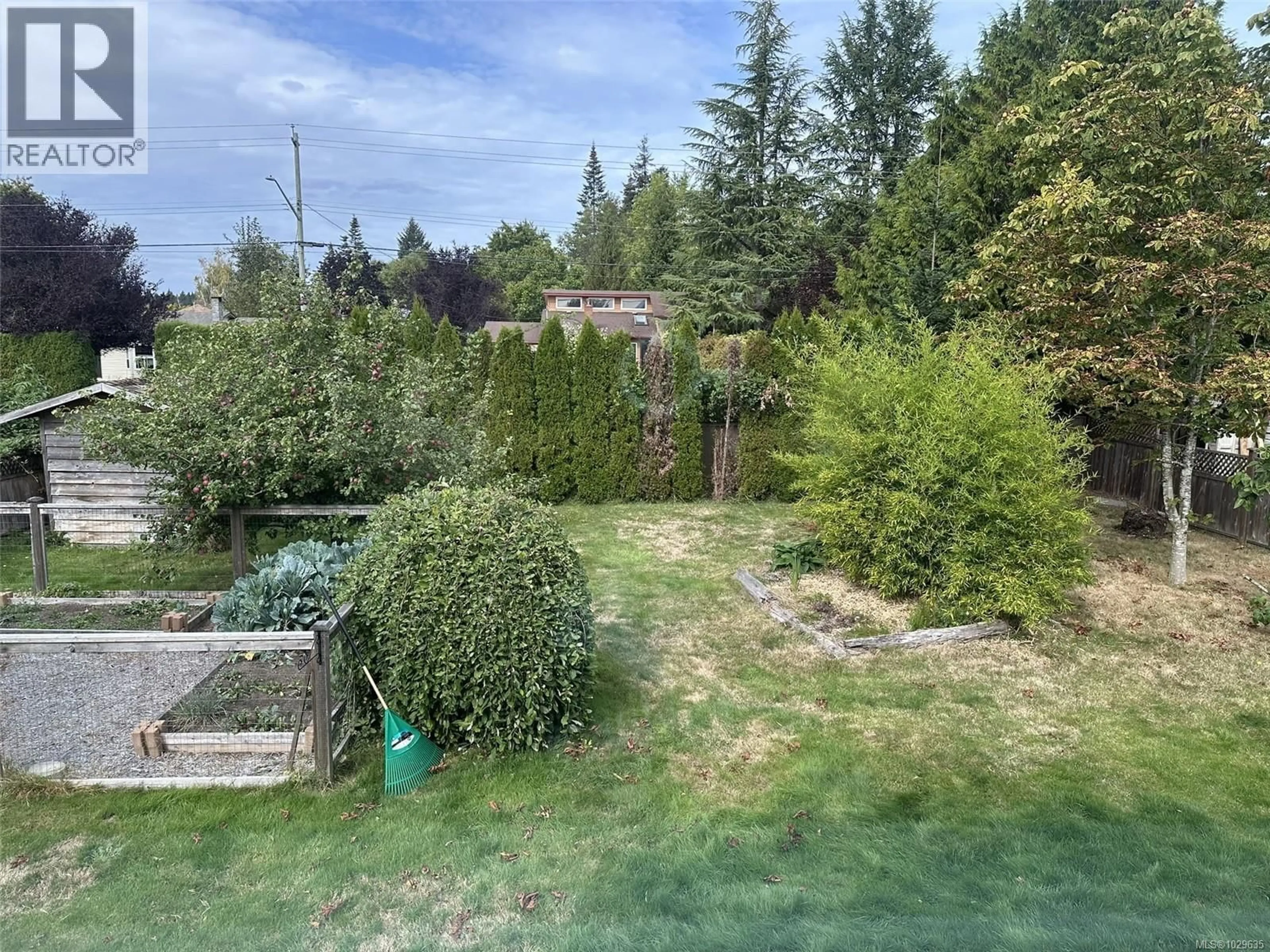 A pic from outside/outdoor area/front of a property/back of a property/a pic from drone, forest/trees view for 1646 MAQUINNA AVENUE, Comox British Columbia V9M3L7