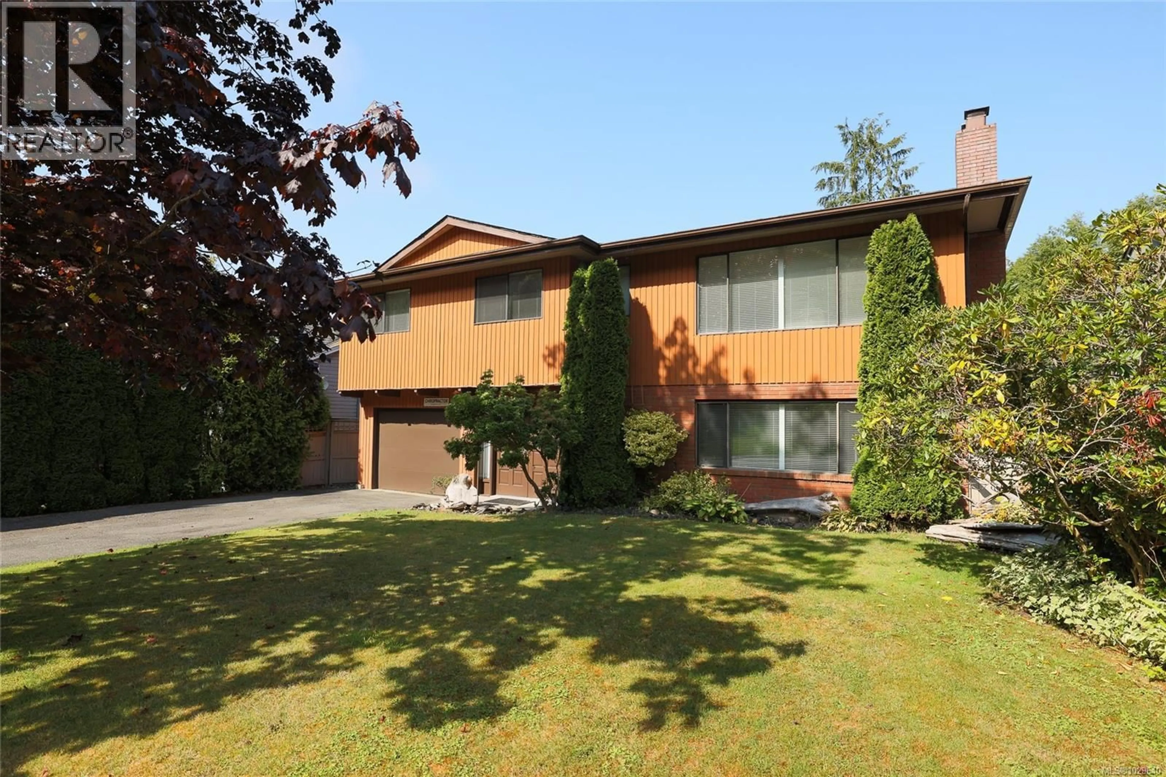 Home with brick exterior material, street for 9160 ELK DRIVE, Port Hardy British Columbia V0N2P0