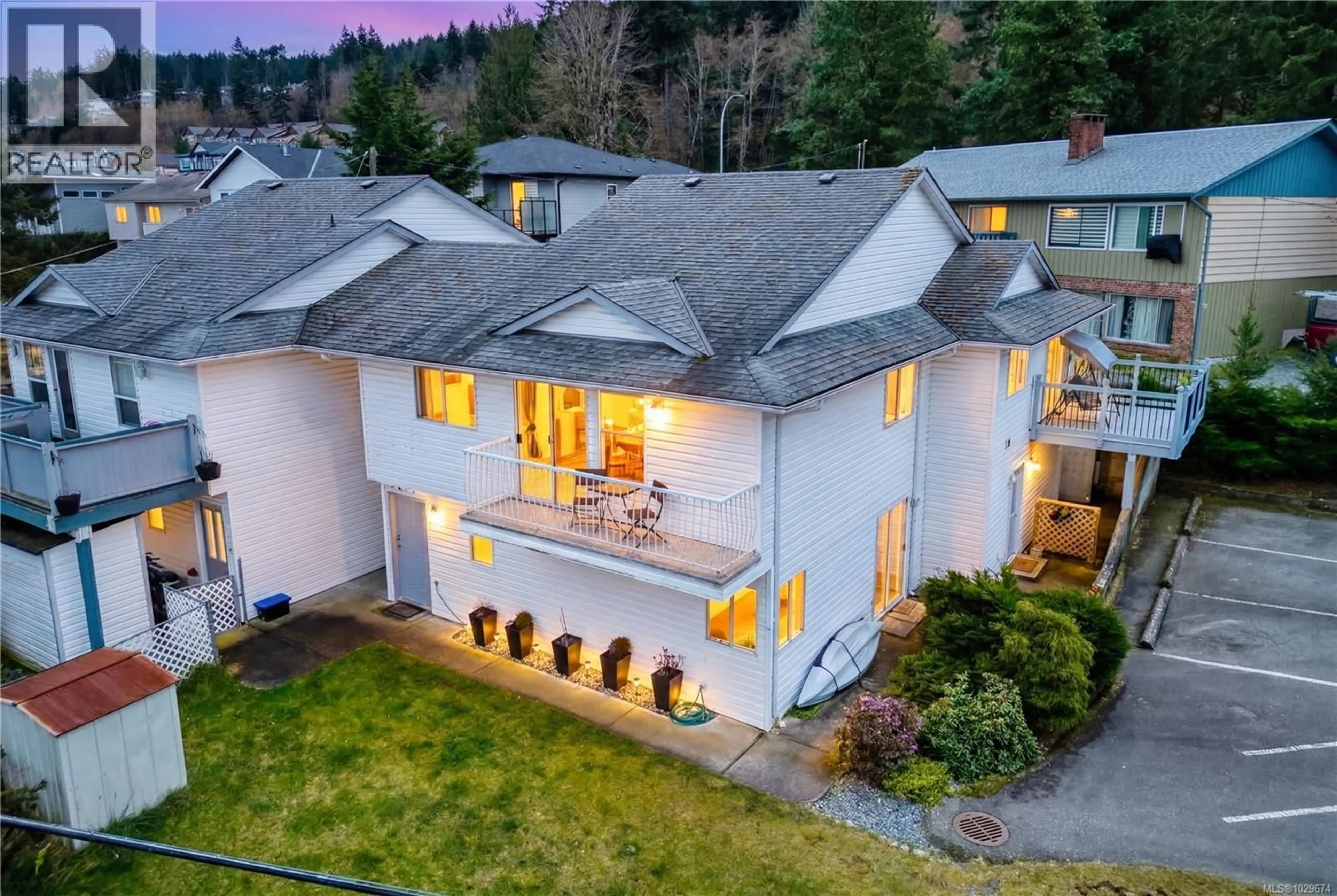 A pic from outside/outdoor area/front of a property/back of a property/a pic from drone, mountain view for 1 - 4801 HAMMOND BAY ROAD, Nanaimo British Columbia V9T5V7