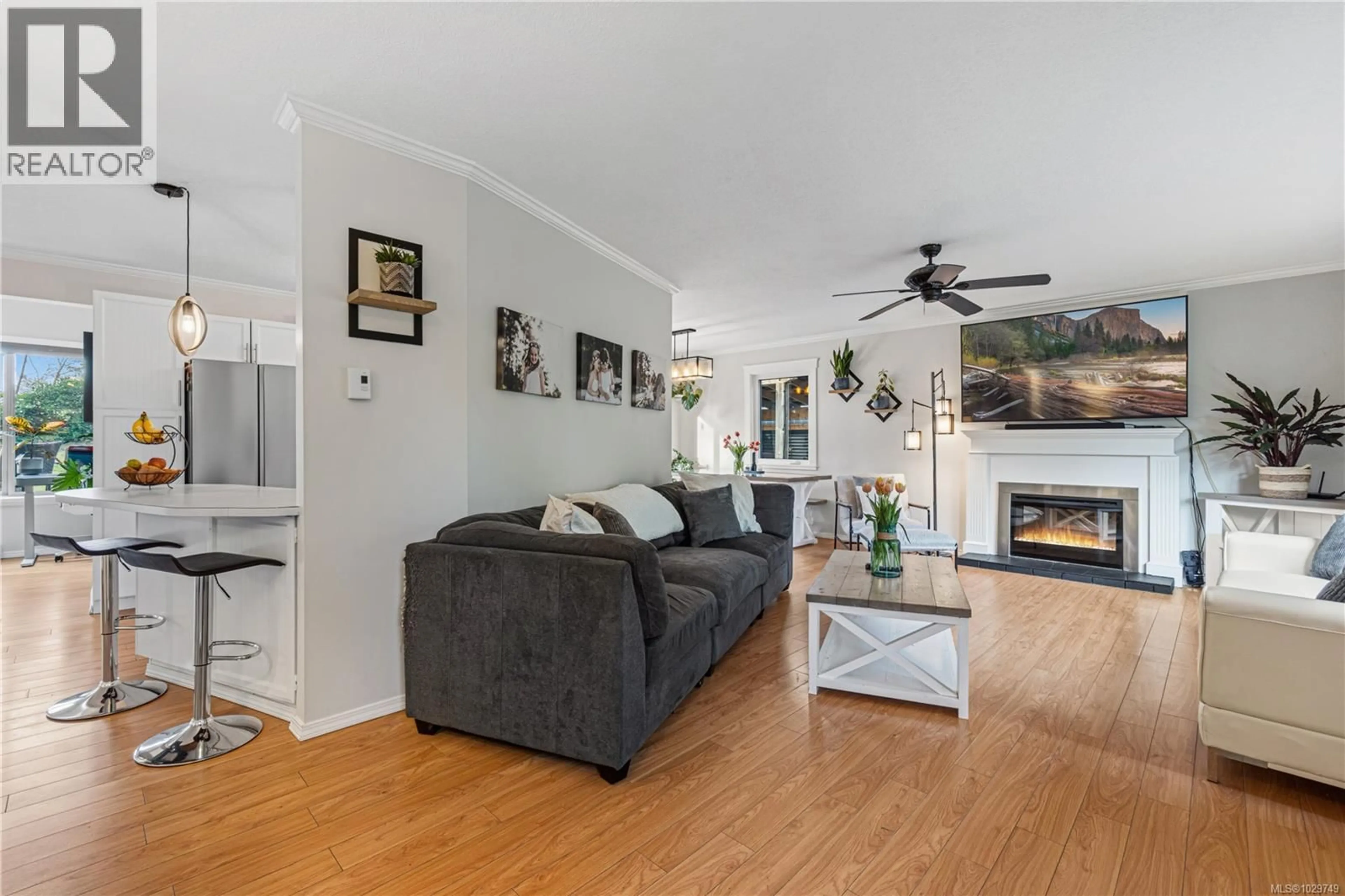 Living room with furniture, wood/laminate floor for 1474 PACIFIC CRESCENT, French Creek British Columbia V9P1X6