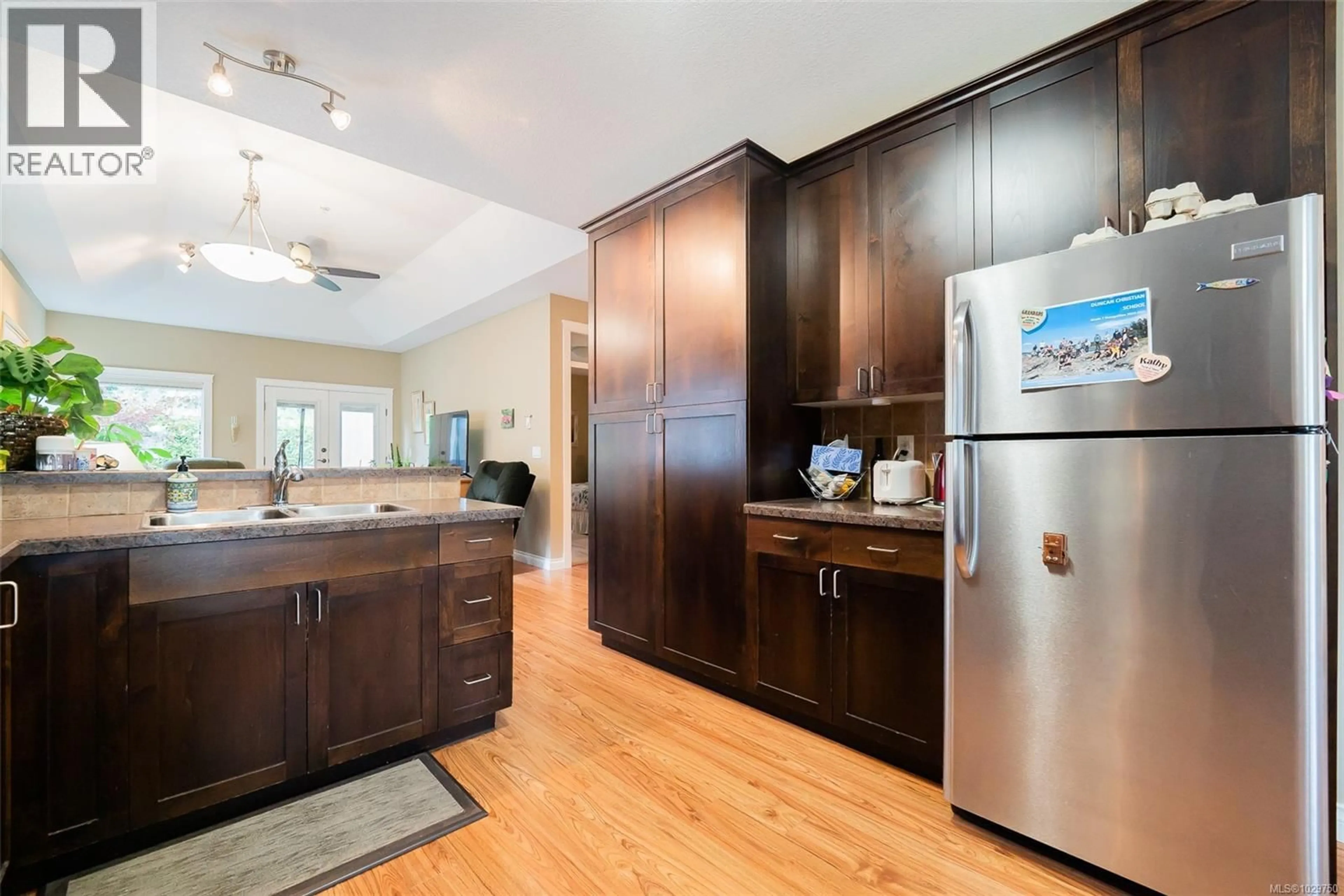 Open concept kitchen, wood/laminate floor for 2405 BRANDON WAY, Nanaimo British Columbia V9T0G2