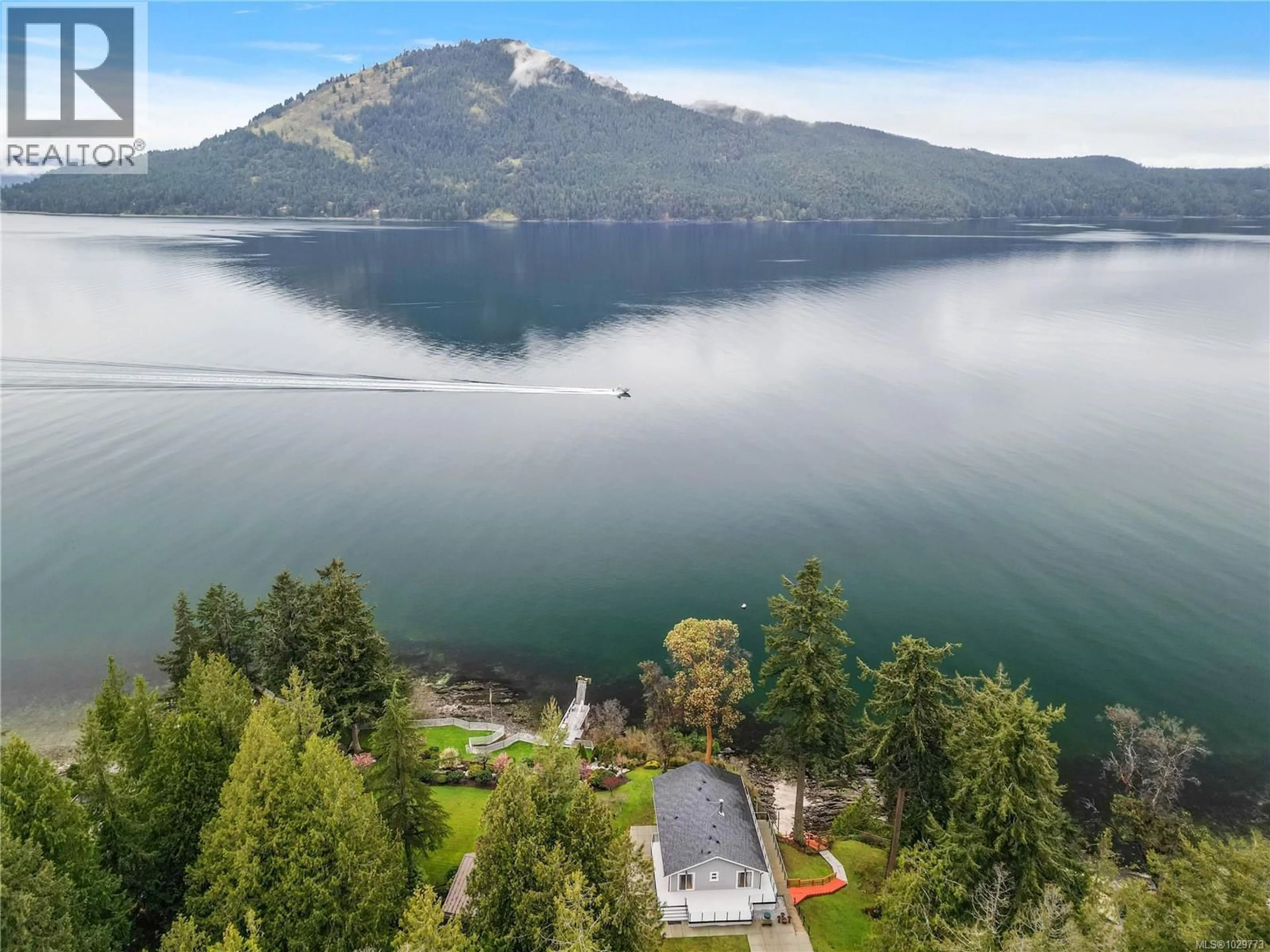A pic from outside/outdoor area/front of a property/back of a property/a pic from drone, water/lake/river/ocean view for 976 LANDS END ROAD, North Saanich British Columbia V8L5L3