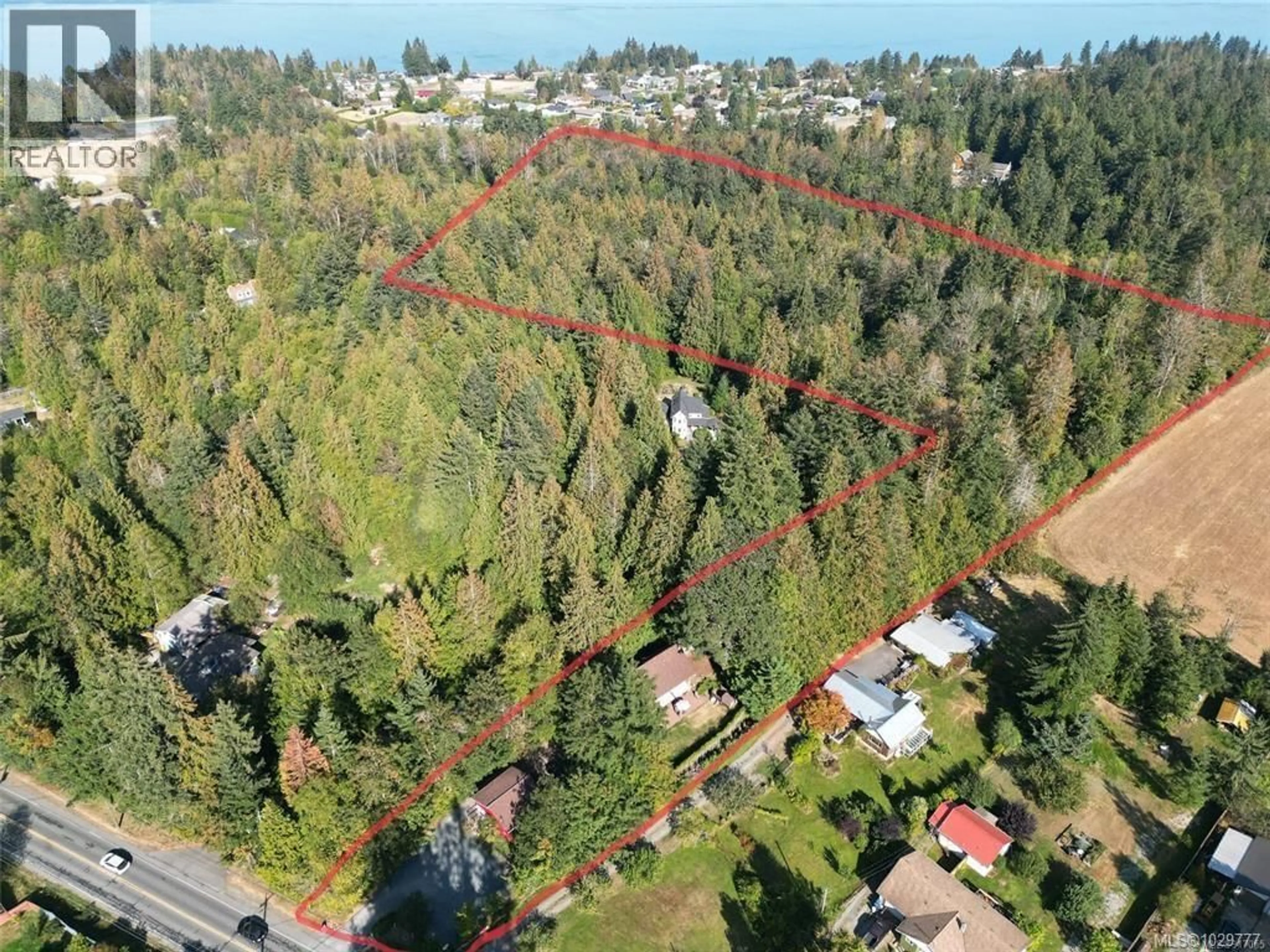 A pic from outside/outdoor area/front of a property/back of a property/a pic from drone, forest/trees view for 10741 CHEMAINUS ROAD, Ladysmith British Columbia V0G2A6