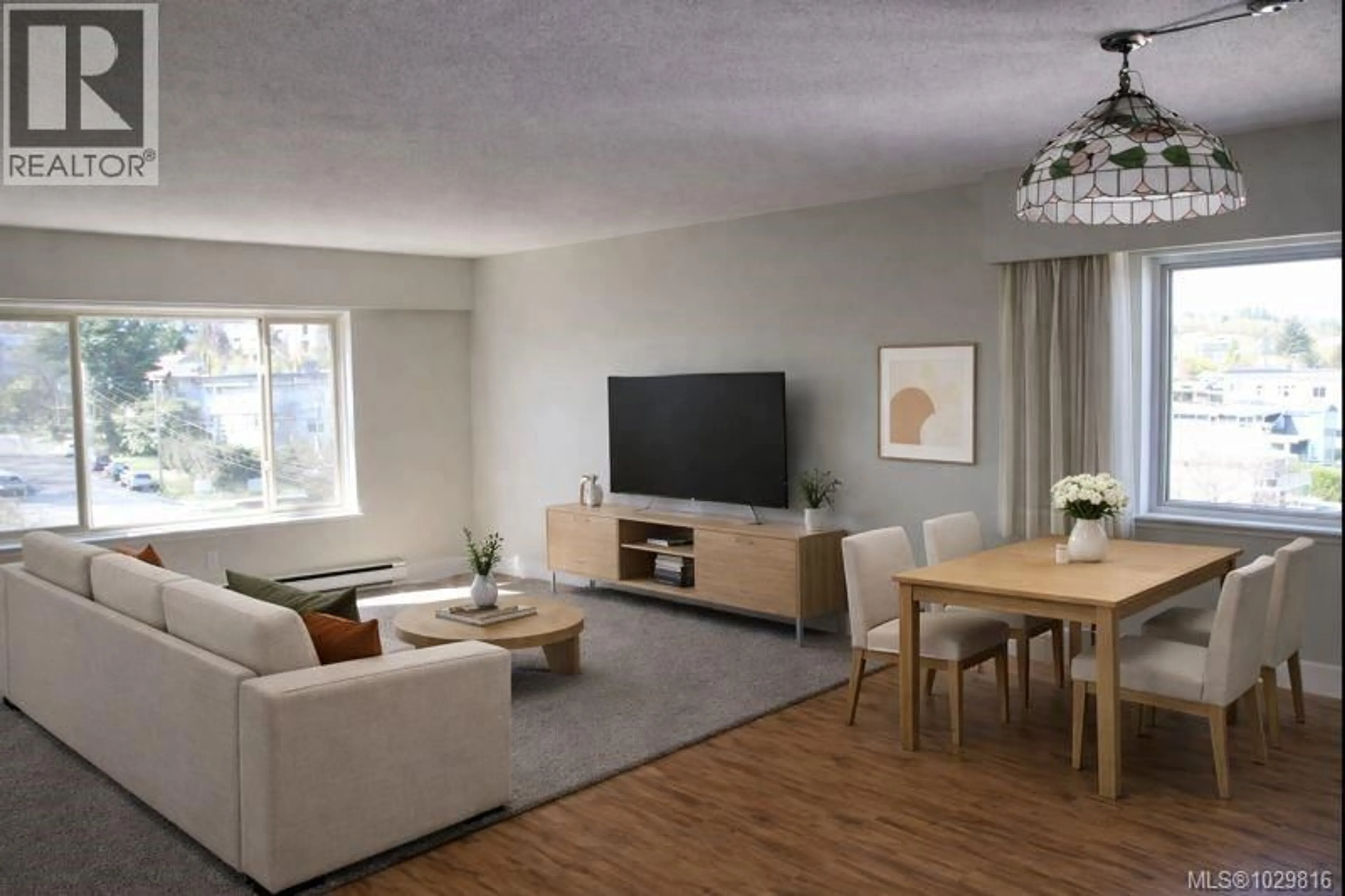 Living room with furniture, wood/laminate floor for 704 - 33 MT. BENSON STREET, Nanaimo British Columbia V9S5L2