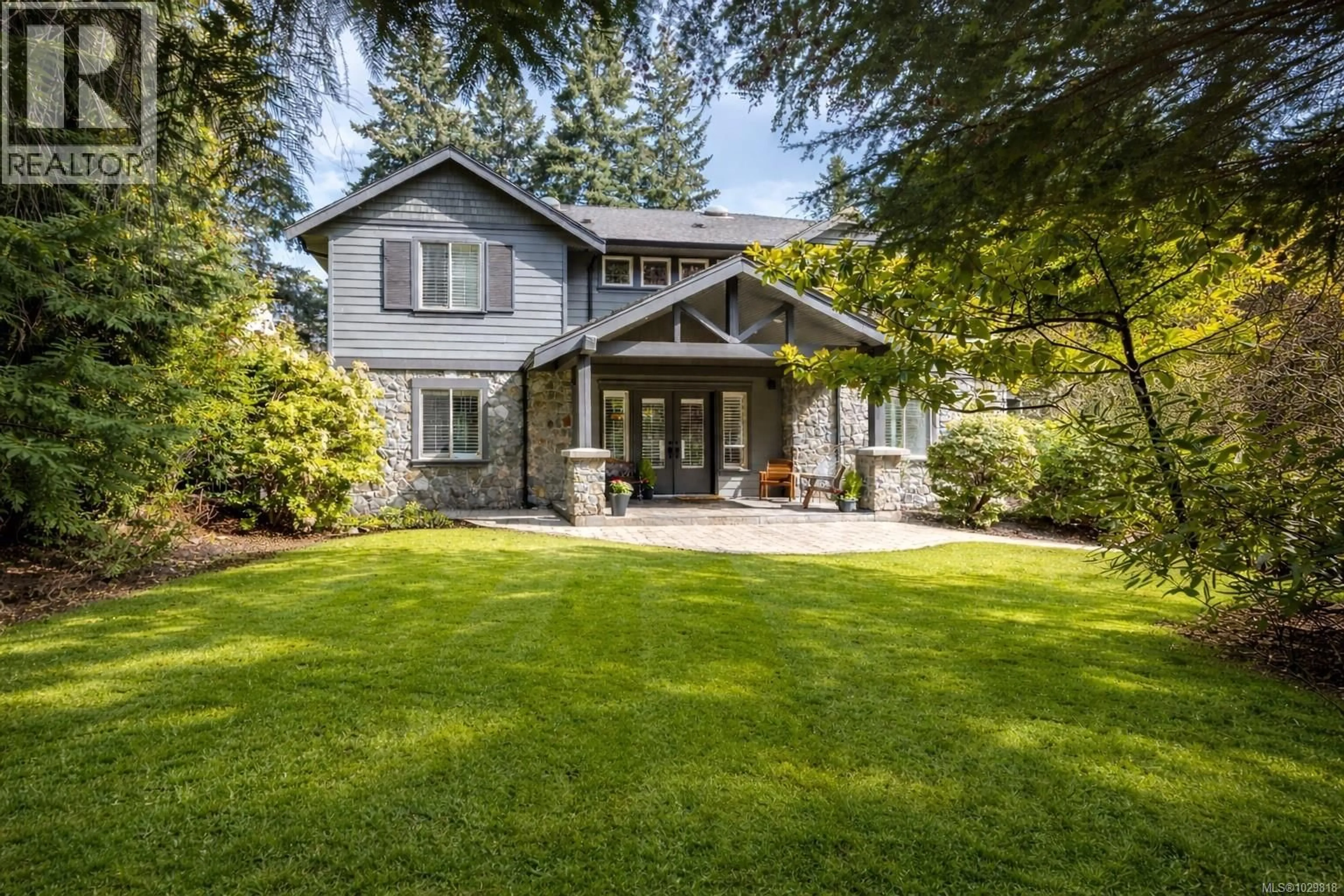 Home with vinyl exterior material, street for 1054 RIVER ROAD, Highlands British Columbia V9B6K2