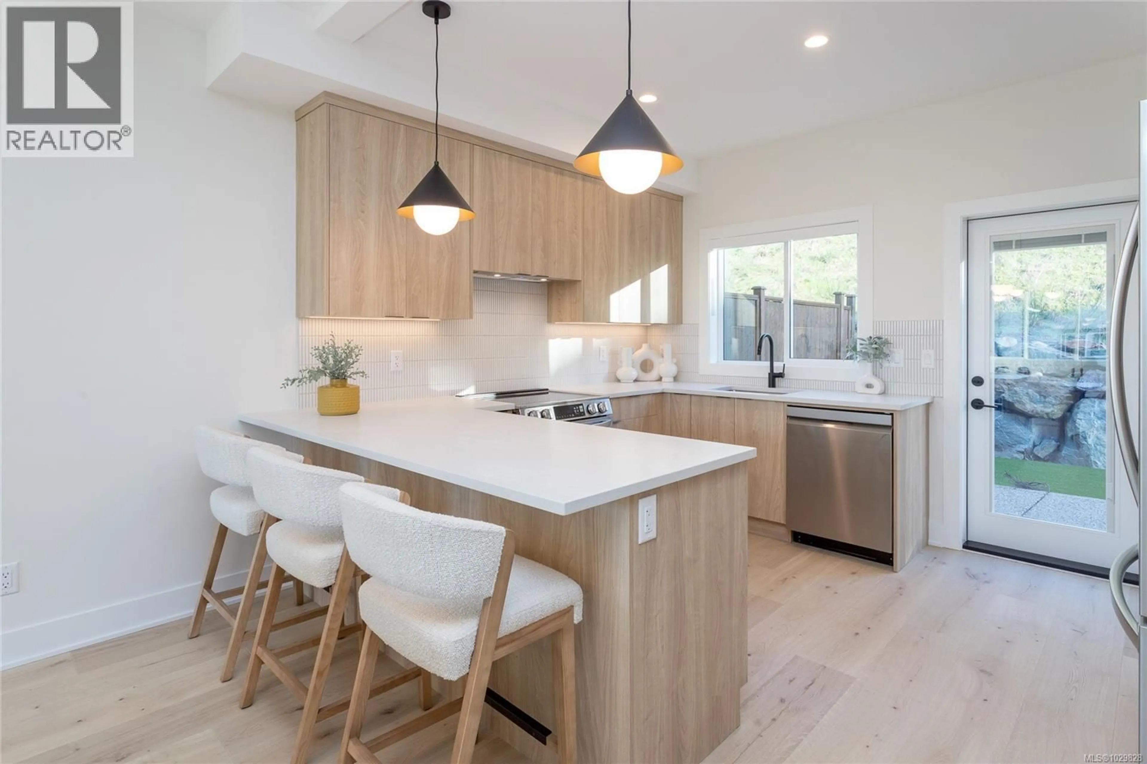 Open concept kitchen, wood/laminate floor for 1431 DOLOMITE RIDGE, Langford British Columbia V9B7G1