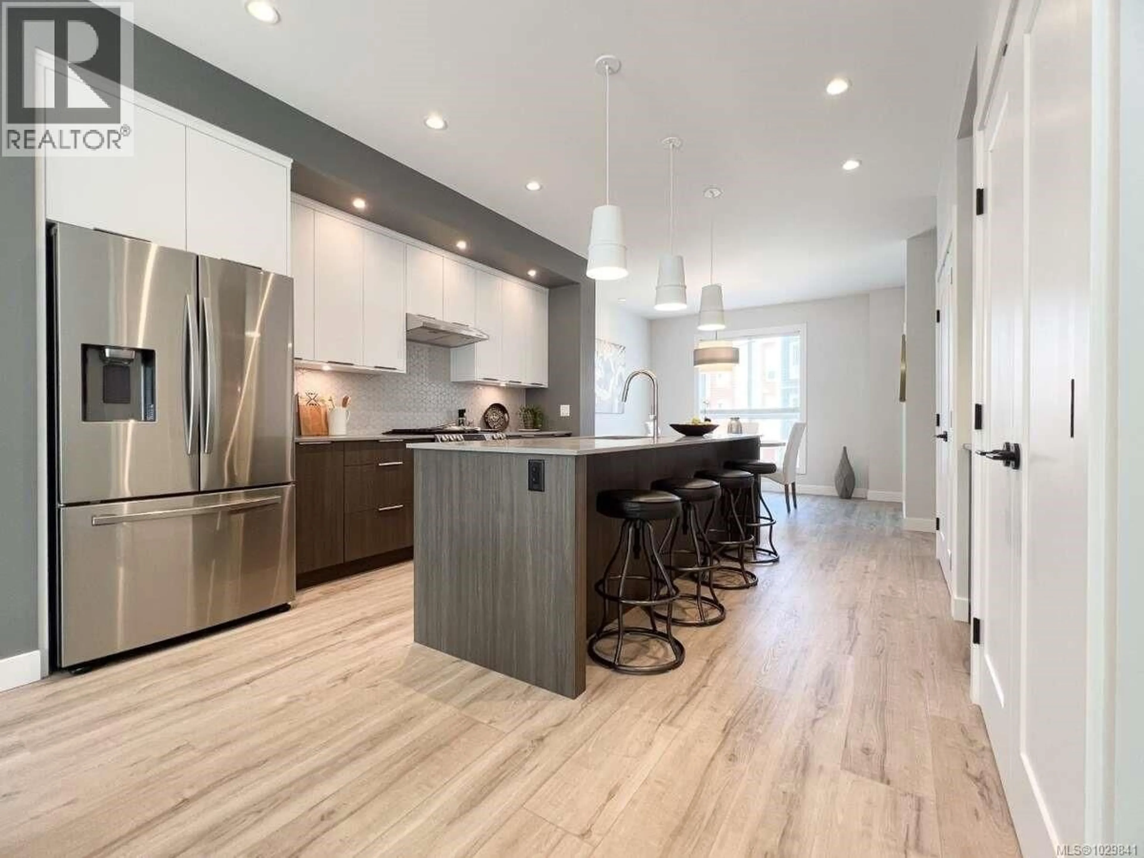 Open concept kitchen, wood/laminate floor for 11 - 2310 GUTHRIE ROAD, Comox British Columbia V9M0C6