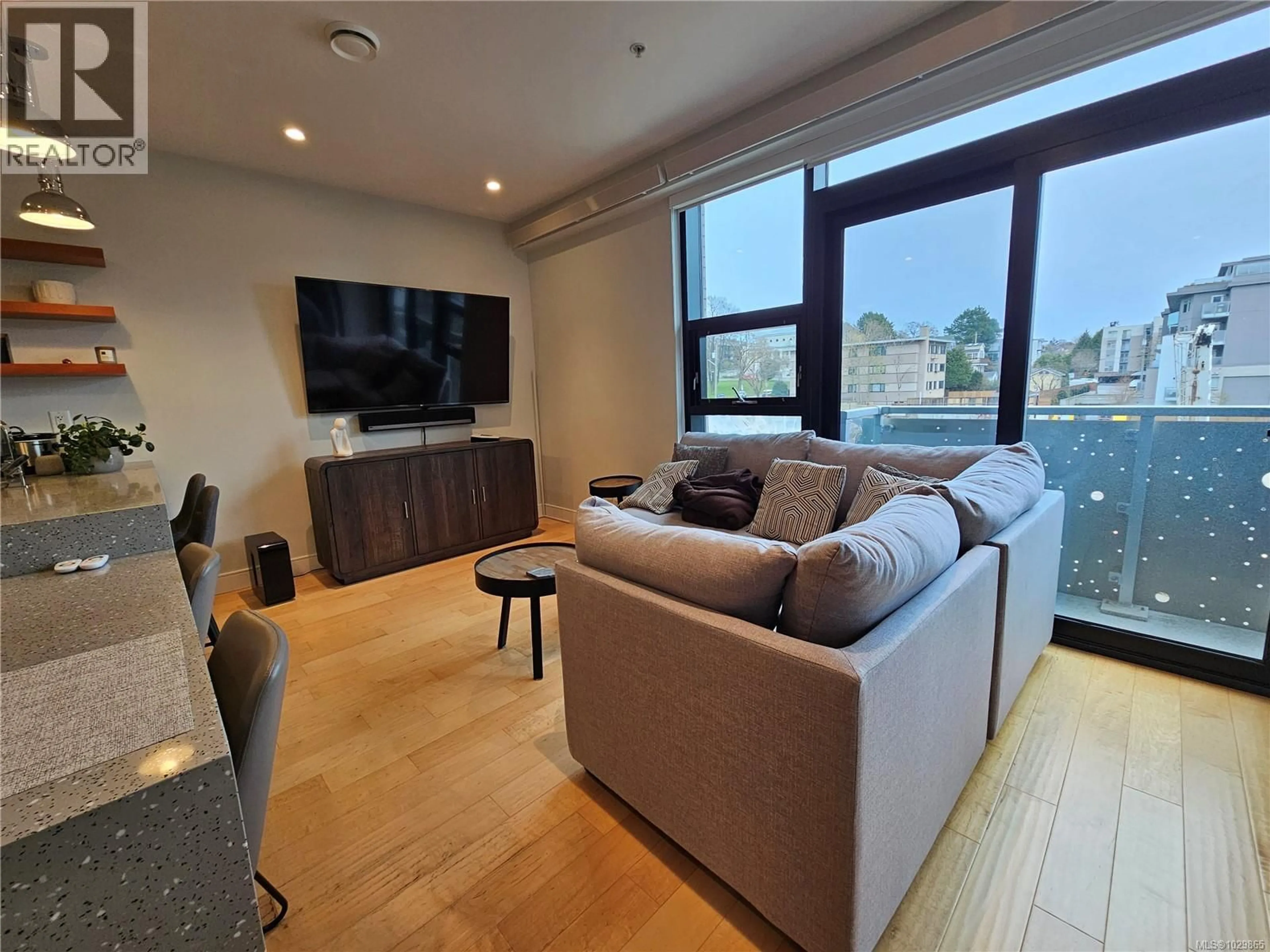 Living room with furniture, wood/laminate floor for S312 - 1411 COOK STREET, Victoria British Columbia V8V0E8