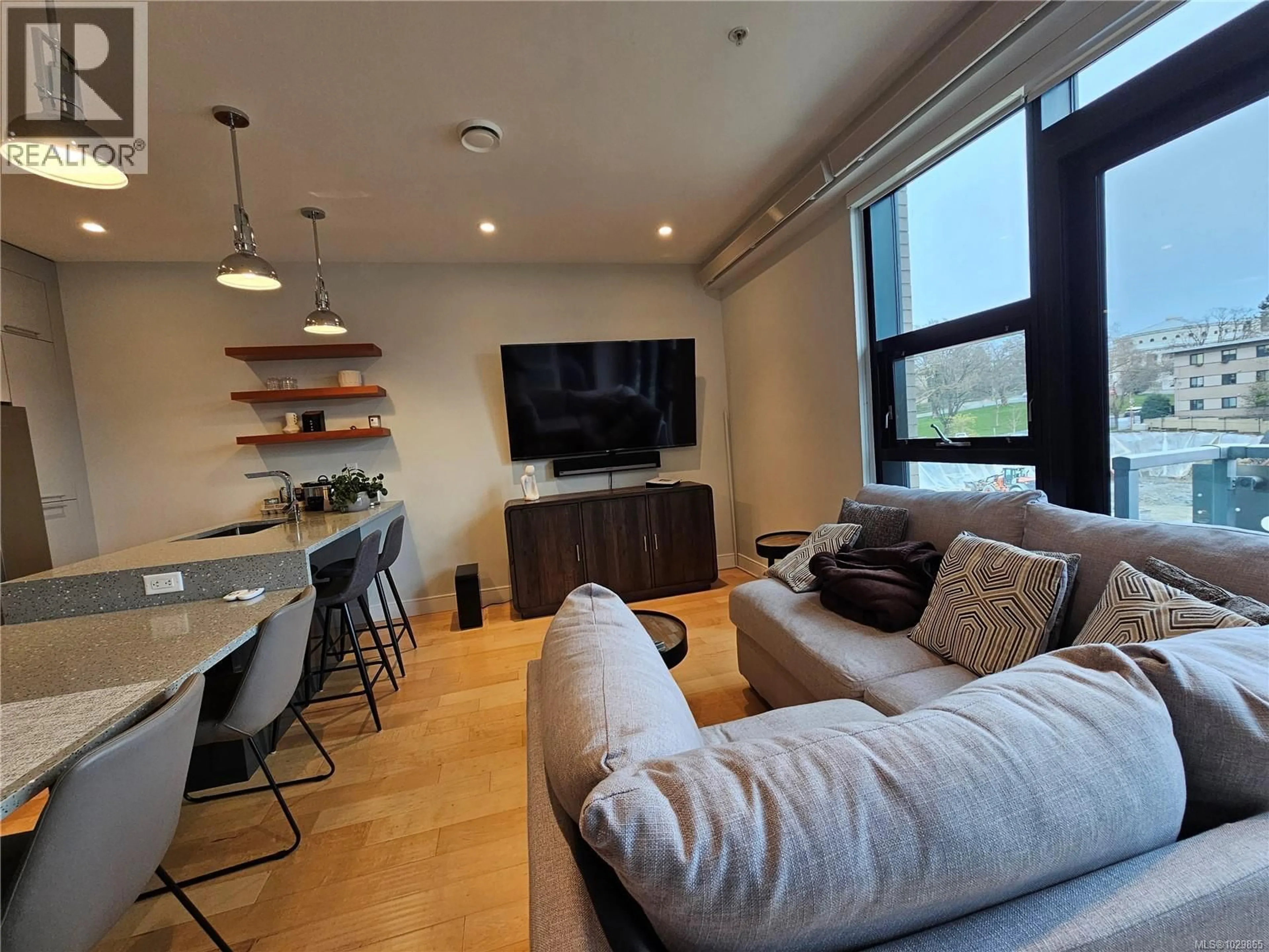 Living room with furniture, wood/laminate floor for S312 - 1411 COOK STREET, Victoria British Columbia V8V0E8