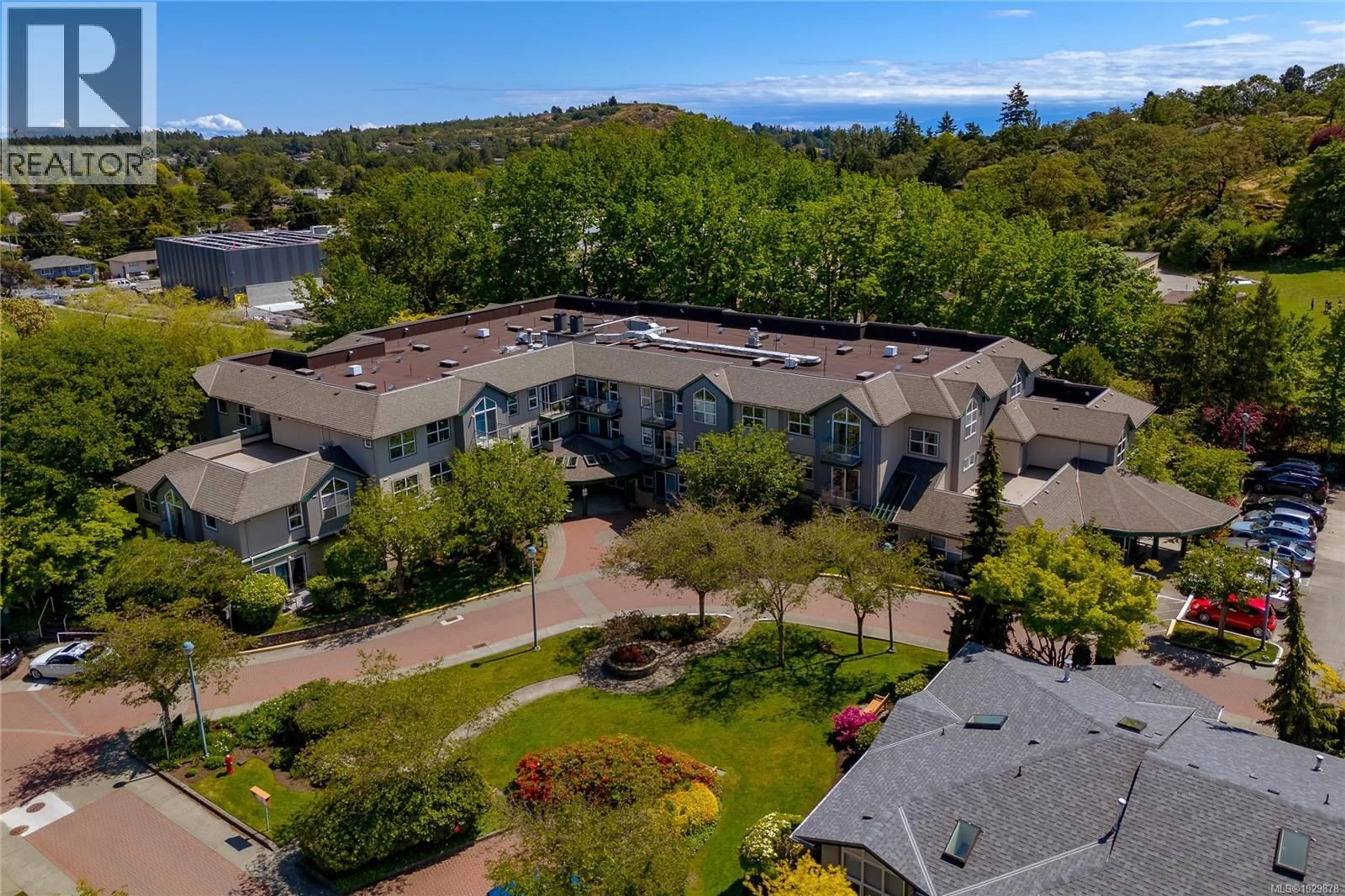 A pic from outside/outdoor area/front of a property/back of a property/a pic from drone, mountain view for 202 - 1485 GARNET ROAD, Saanich British Columbia V8P5T5