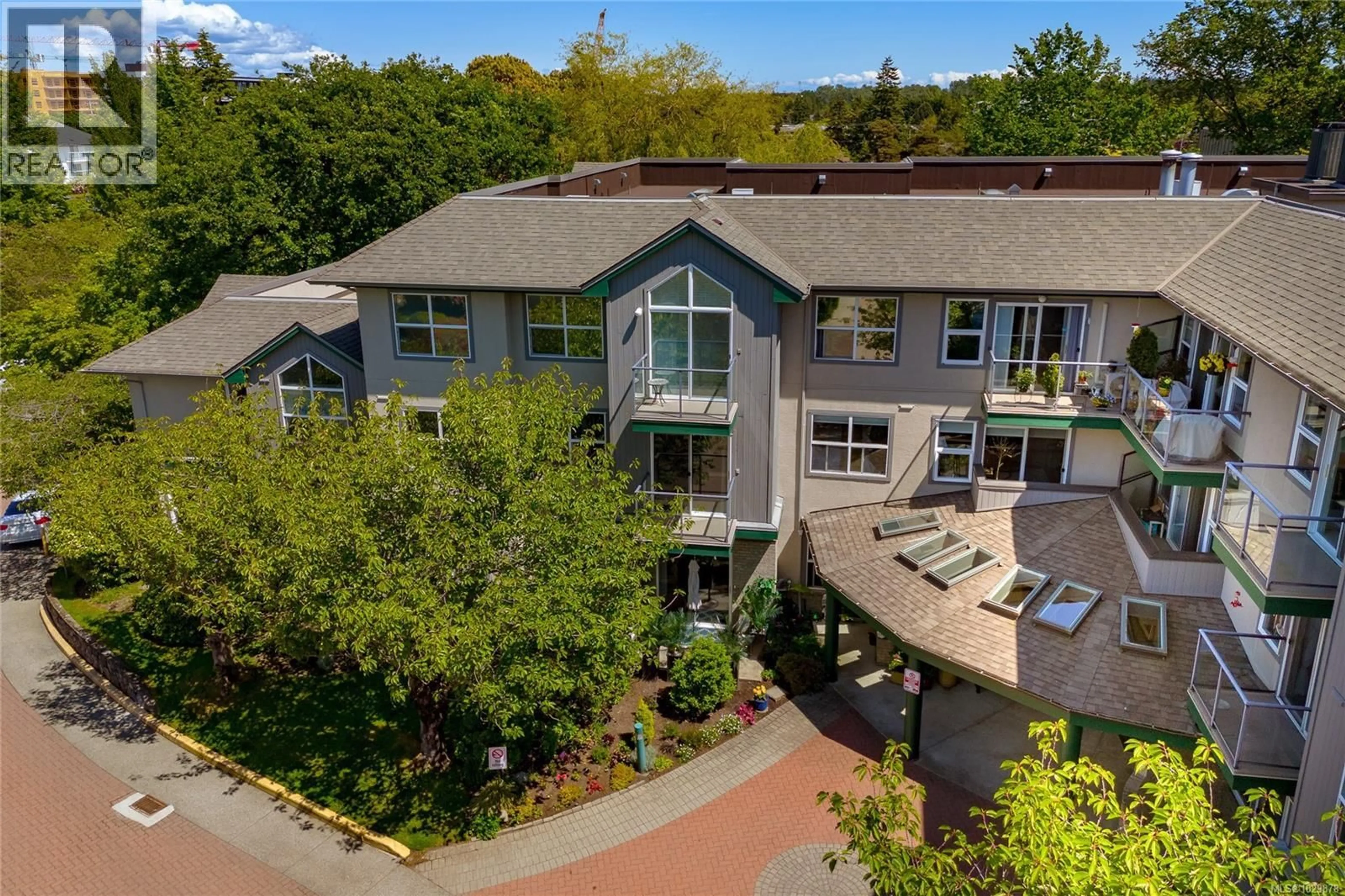 A pic from outside/outdoor area/front of a property/back of a property/a pic from drone, unknown for 202 - 1485 GARNET ROAD, Saanich British Columbia V8P5T5