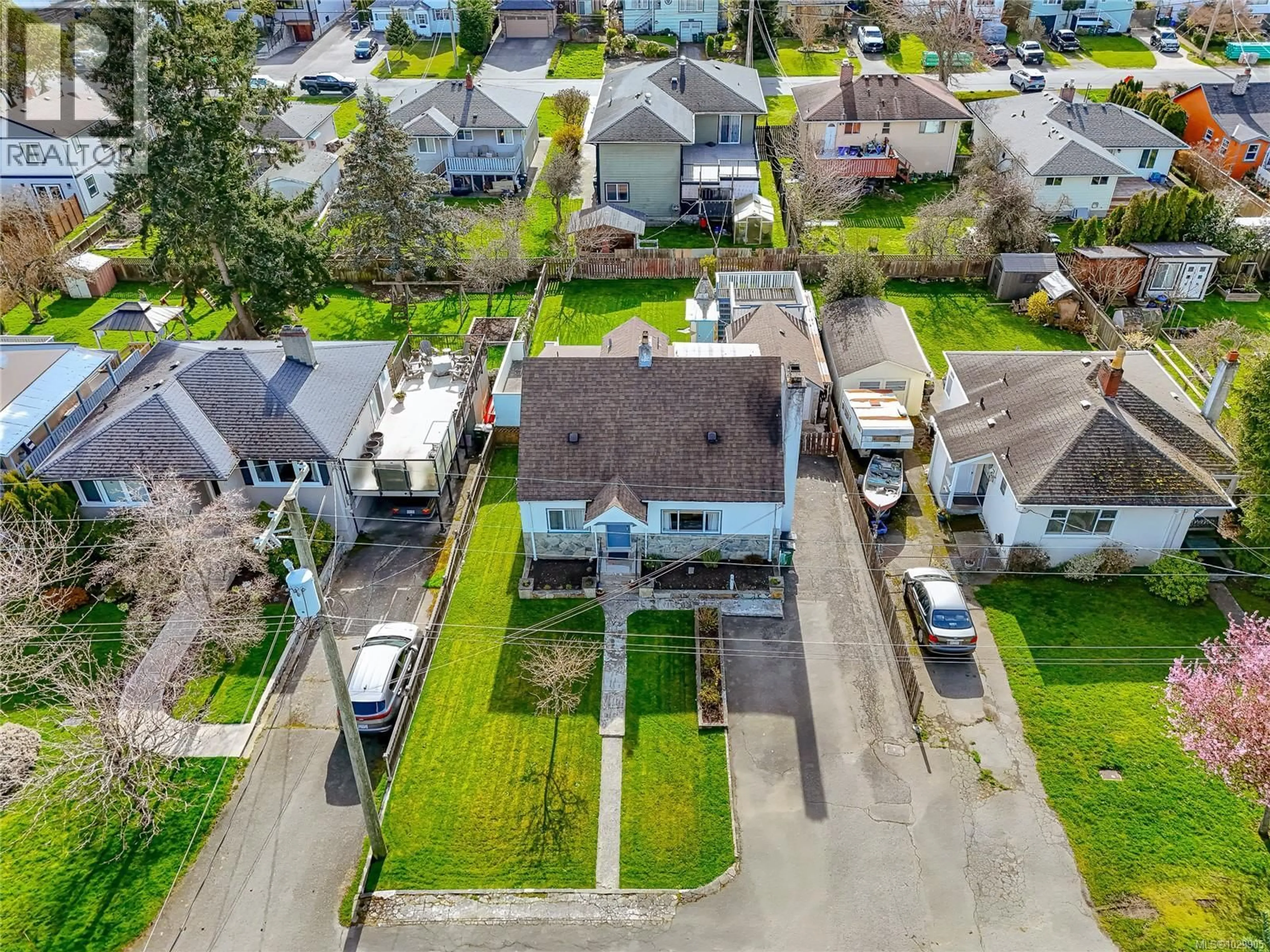 A pic from outside/outdoor area/front of a property/back of a property/a pic from drone, street for 3155 EARL GREY STREET, Saanich British Columbia V9A1X1