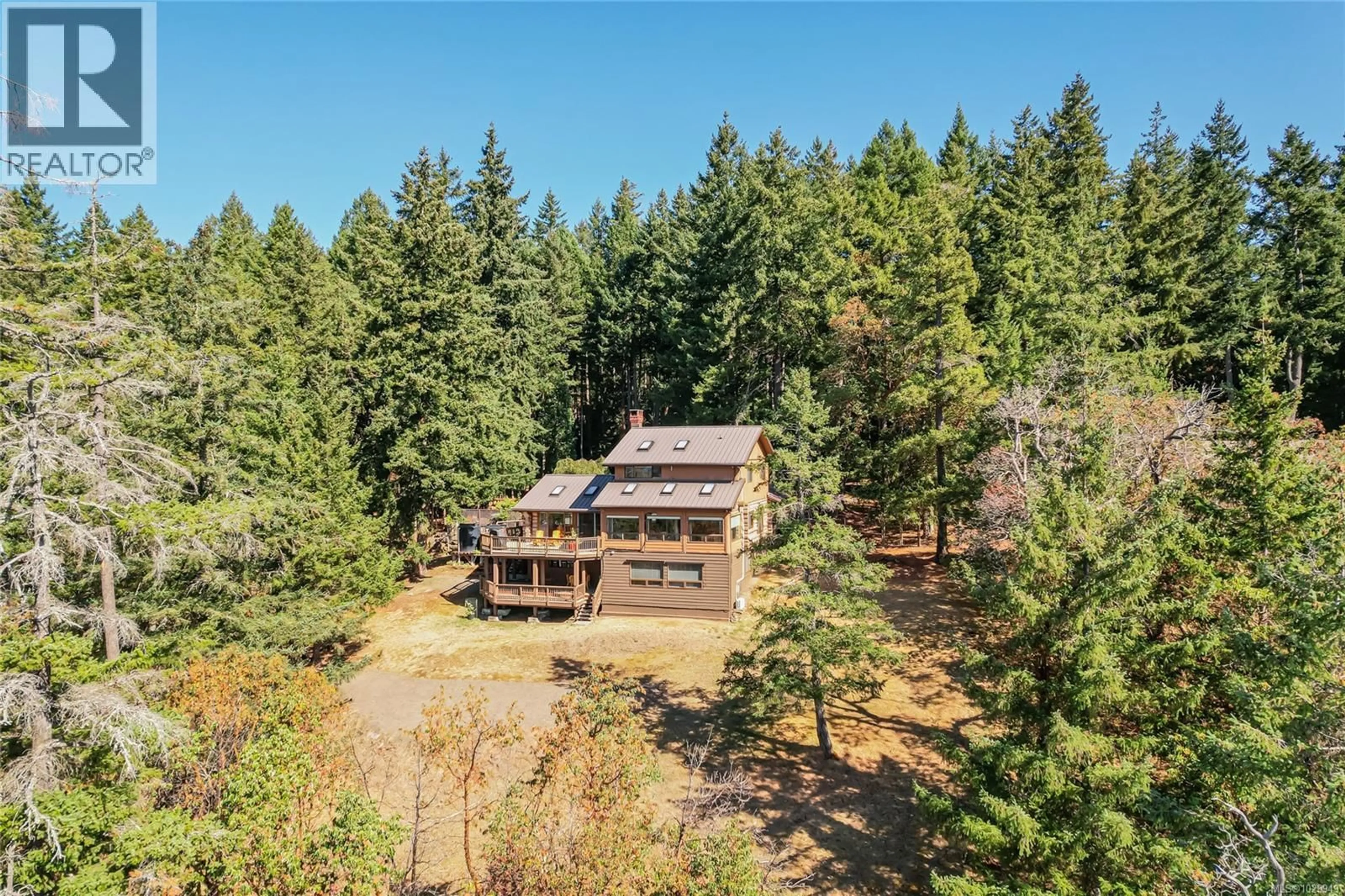 A pic from outside/outdoor area/front of a property/back of a property/a pic from drone, forest/trees view for 108 TERN ROAD, Salt Spring British Columbia V8K1G9
