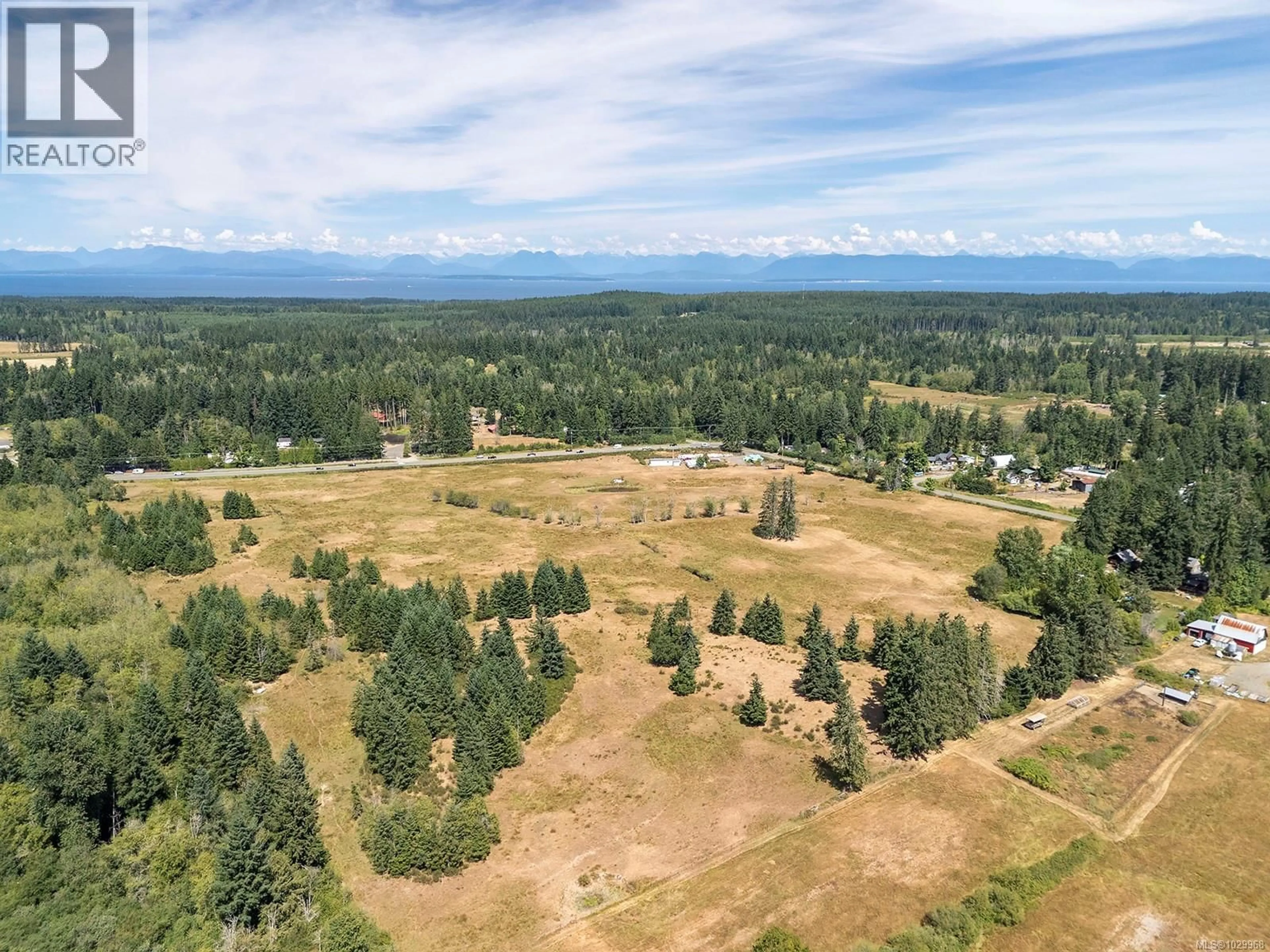 A pic from outside/outdoor area/front of a property/back of a property/a pic from drone, unknown for 7561 HOWARD ROAD, Black Creek British Columbia V9J1G2