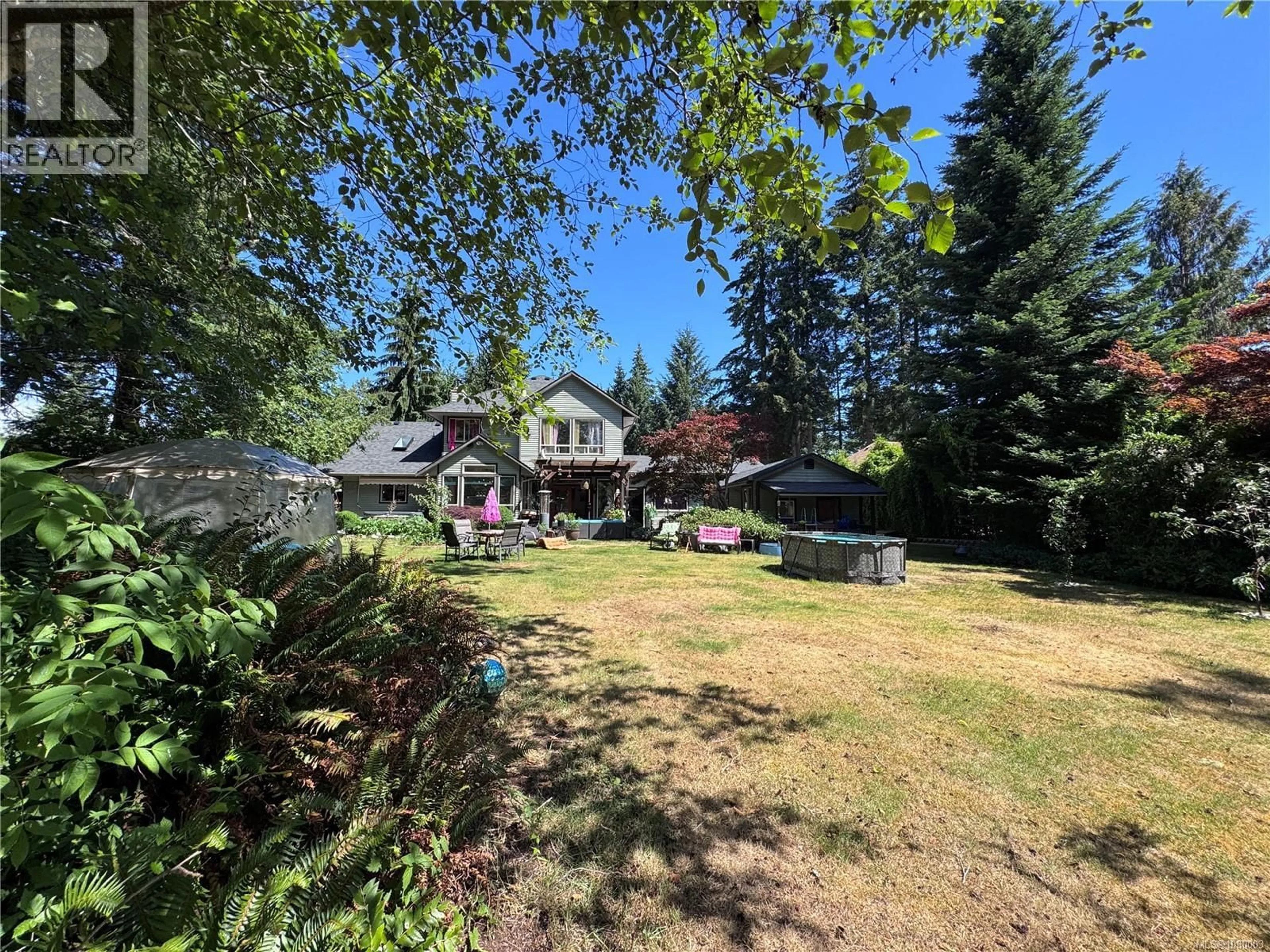 A pic from outside/outdoor area/front of a property/back of a property/a pic from drone, unknown for 8856 MCLAREY AVENUE, Black Creek British Columbia V9J1A3