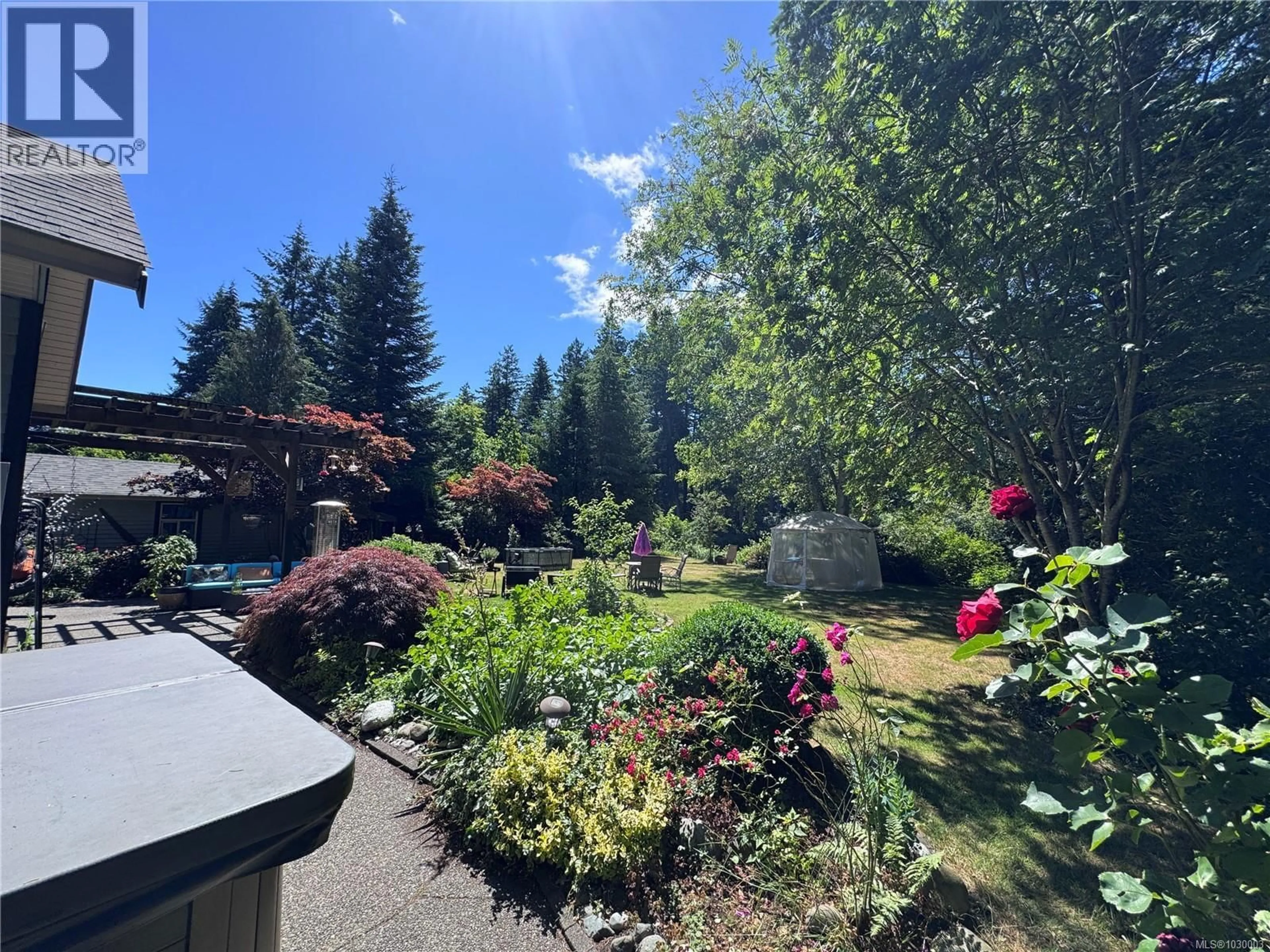 A pic from outside/outdoor area/front of a property/back of a property/a pic from drone, forest/trees view for 8856 MCLAREY AVENUE, Black Creek British Columbia V9J1A3