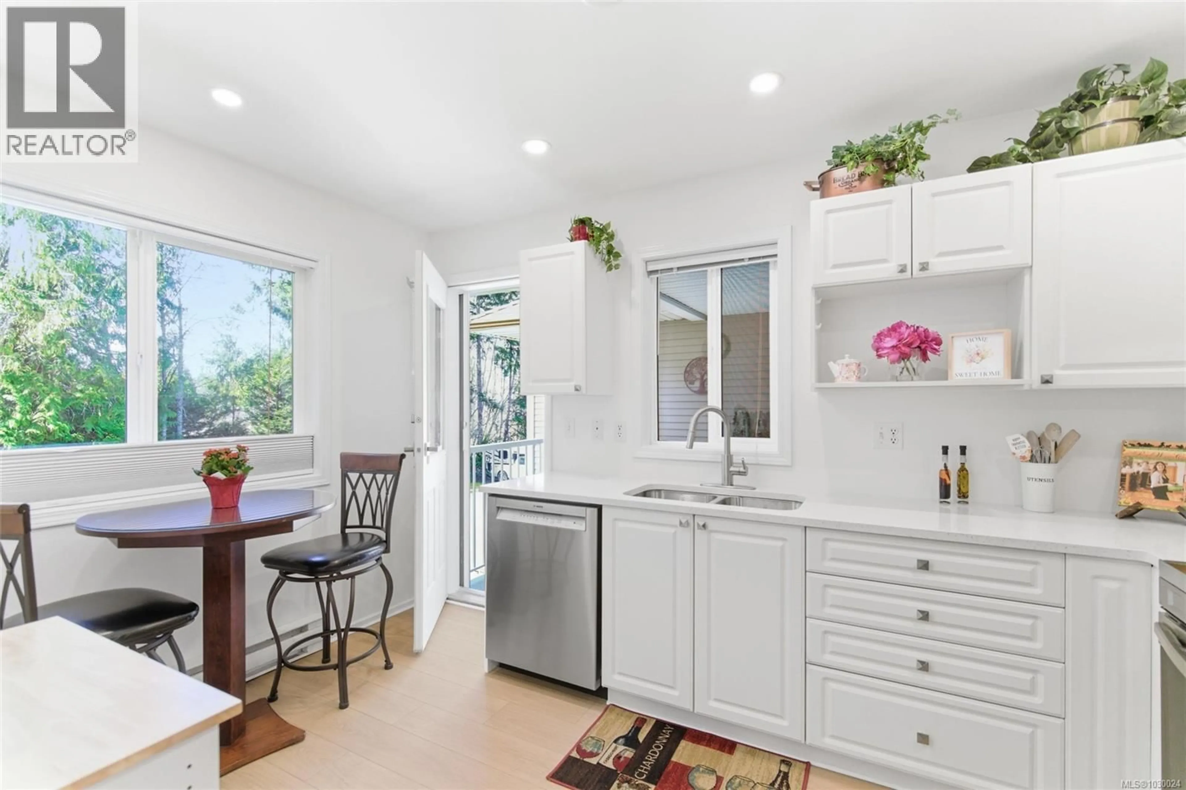 Open concept kitchen, ceramic/tile floor for 203 - 440 SCHLEY PLACE, Qualicum Beach British Columbia V9K2M5