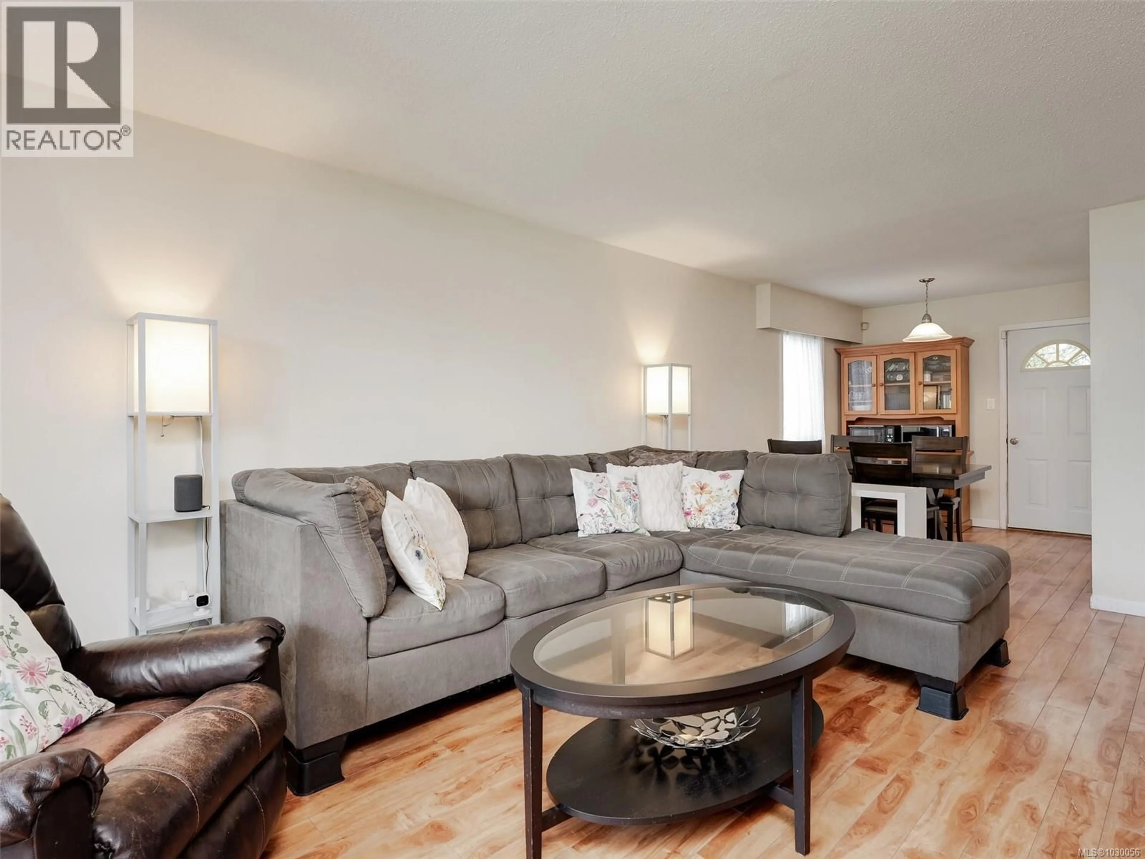 Living room with furniture, wood/laminate floor for 2035 MELVILLE DRIVE, Sidney British Columbia V0R1S1