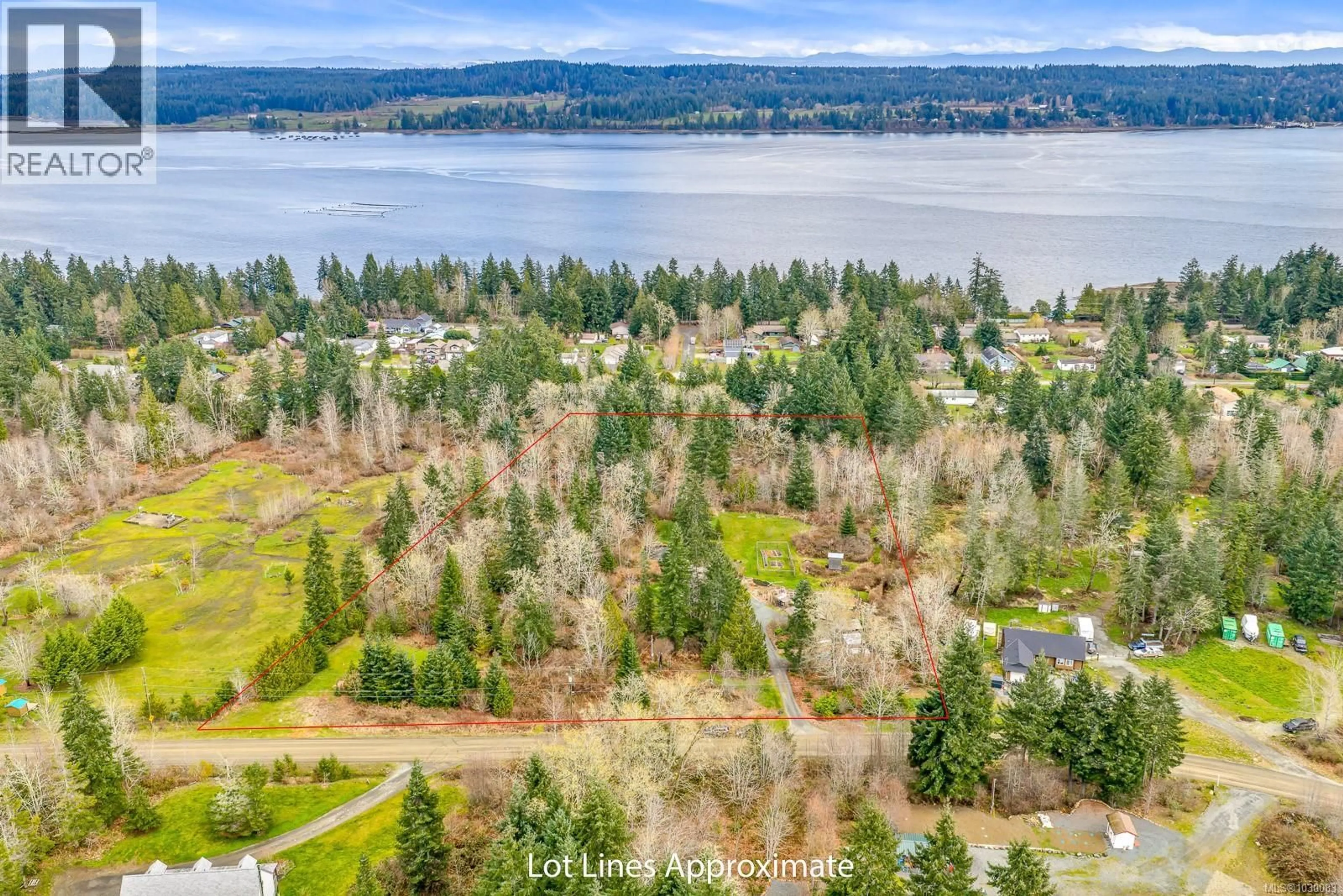 A pic from outside/outdoor area/front of a property/back of a property/a pic from drone, water/lake/river/ocean view for 6590 COUNTRY ROAD, Fanny Bay British Columbia V0R1W0