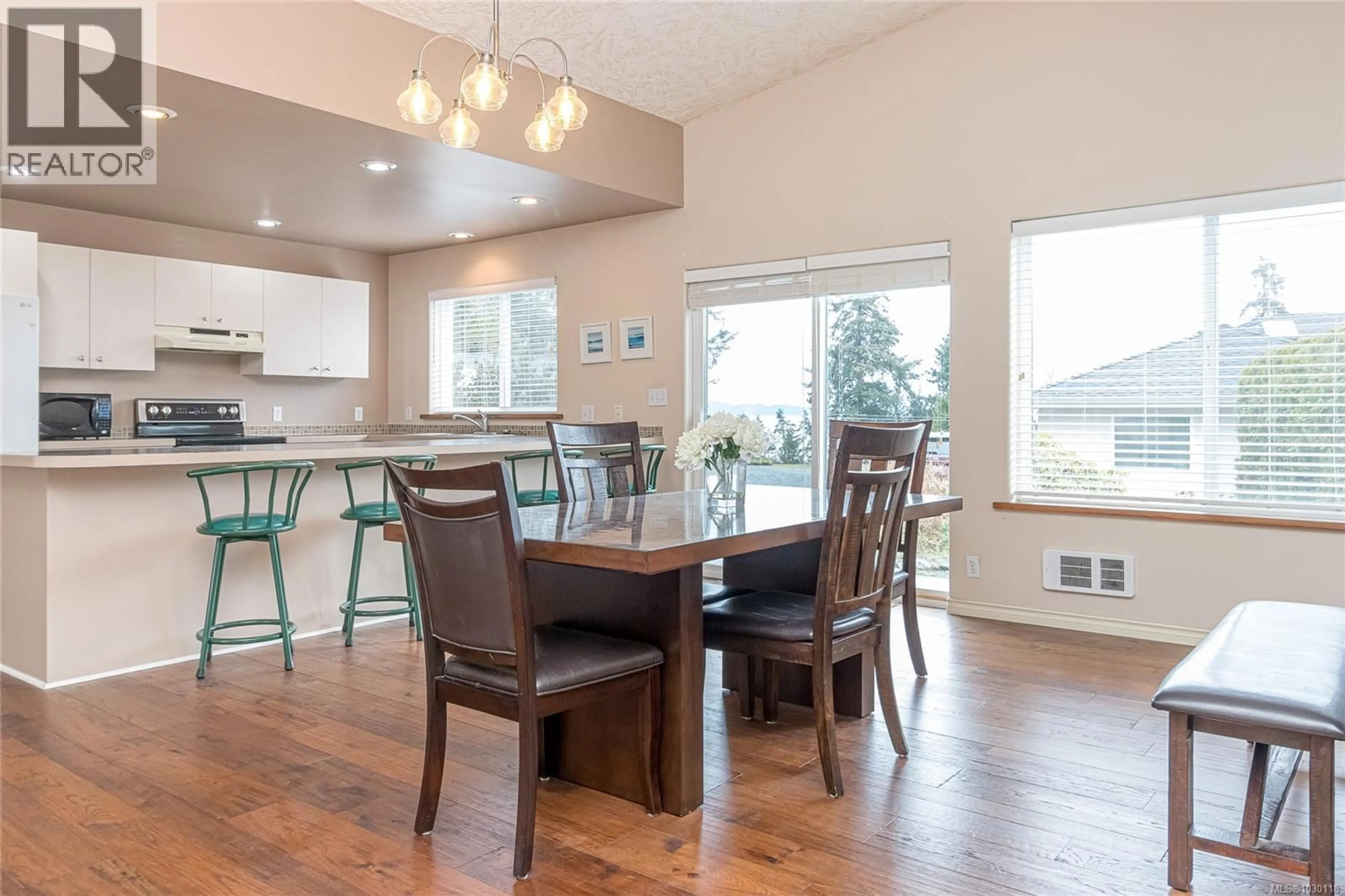 Open concept kitchen, wood/laminate floor for 3043 RAYMUR PLACE, Qualicum Beach British Columbia V9K2N9