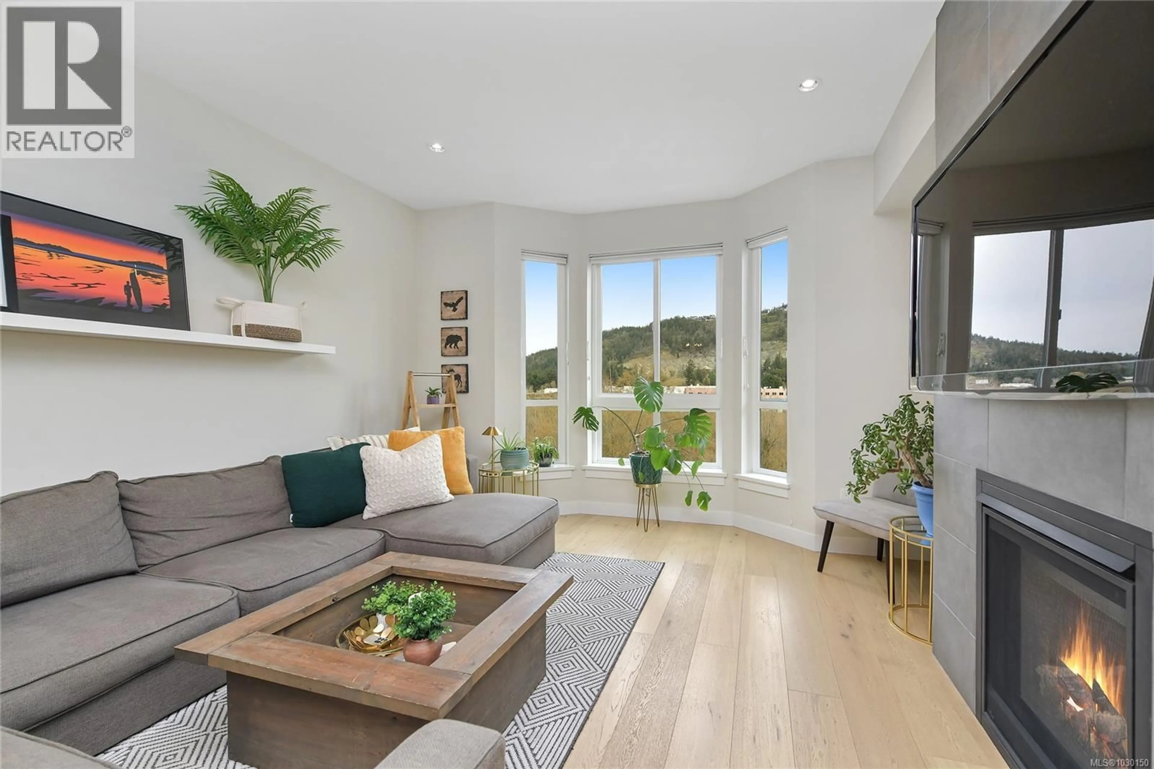 Living room with furniture, wood/laminate floor for 2826 TURNSTYLE CRESCENT, Langford British Columbia V9B0T8