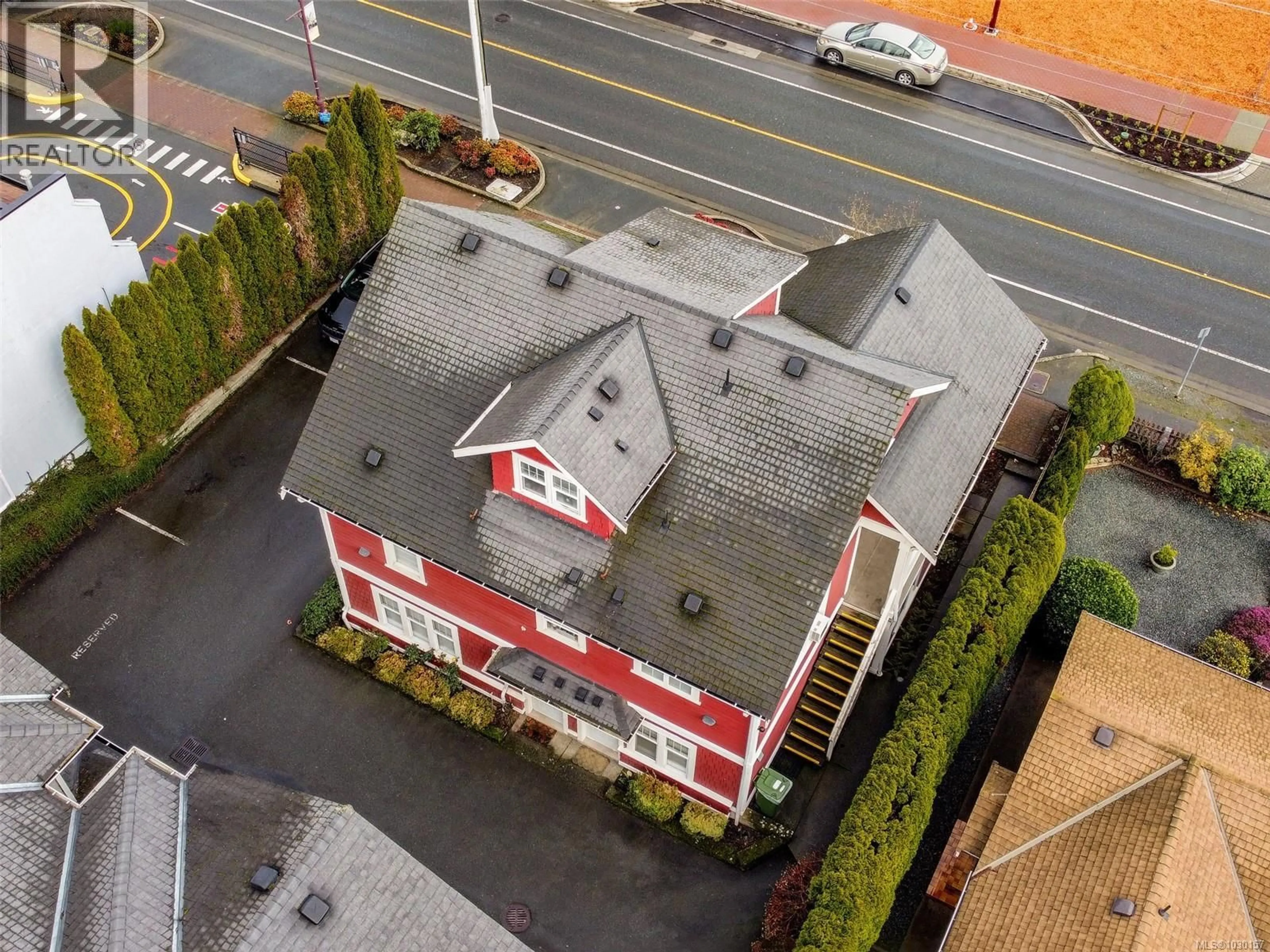 A pic from outside/outdoor area/front of a property/back of a property/a pic from drone, building for 104 - 2766 PEATT ROAD, Langford British Columbia V9B3V3