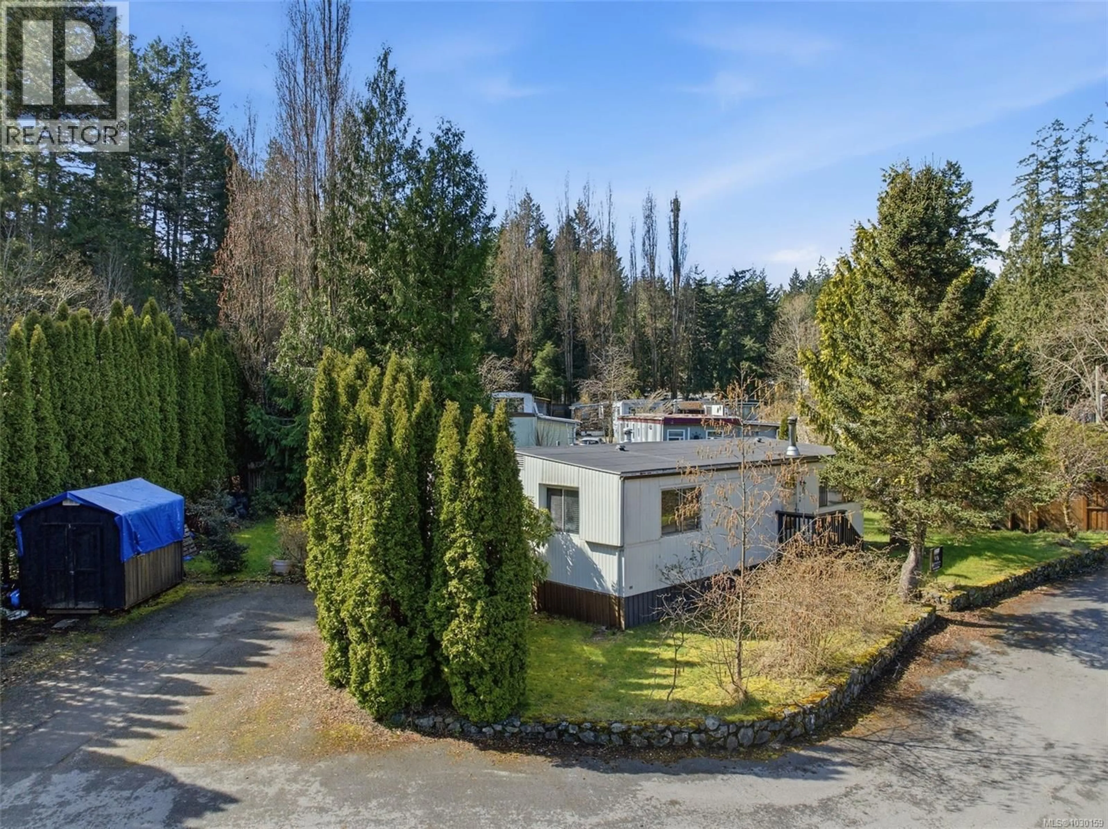 A pic from outside/outdoor area/front of a property/back of a property/a pic from drone, forest/trees view for 11 - 2615 OTTER POINT ROAD, Sooke British Columbia V0S1N0