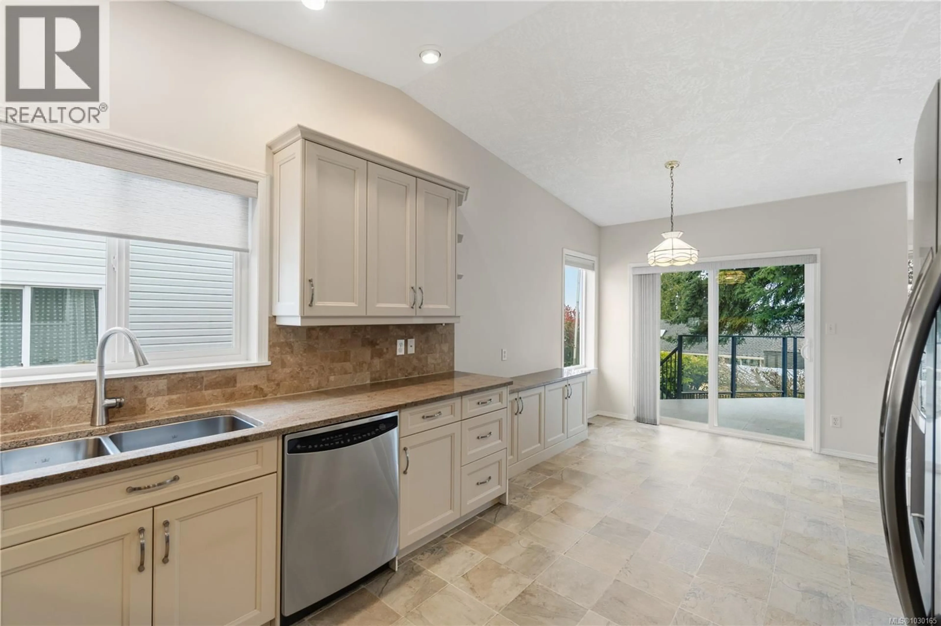 Open concept kitchen, ceramic/tile floor for 5735 MALIBU TERRACE, Nanaimo British Columbia V9T5Y8