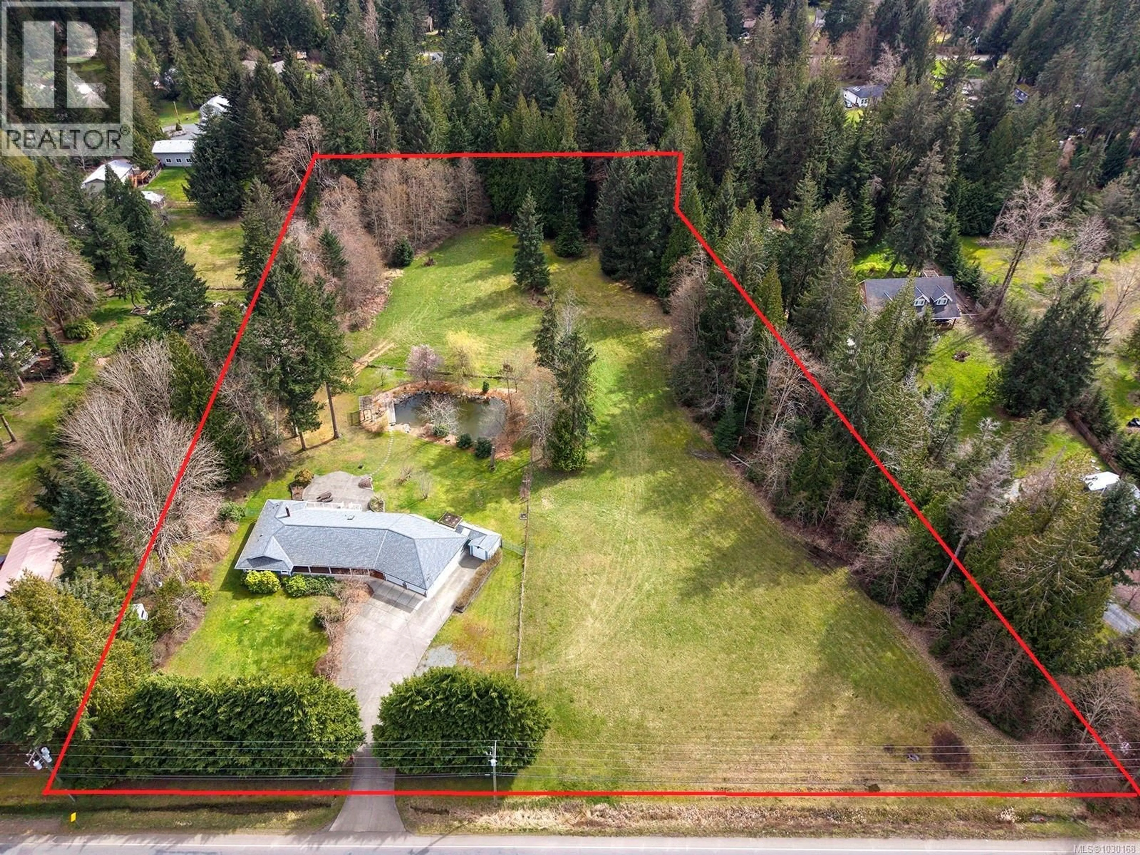 A pic from outside/outdoor area/front of a property/back of a property/a pic from drone, forest/trees view for 2495 HUBAND ROAD, Courtenay British Columbia V9J1L6