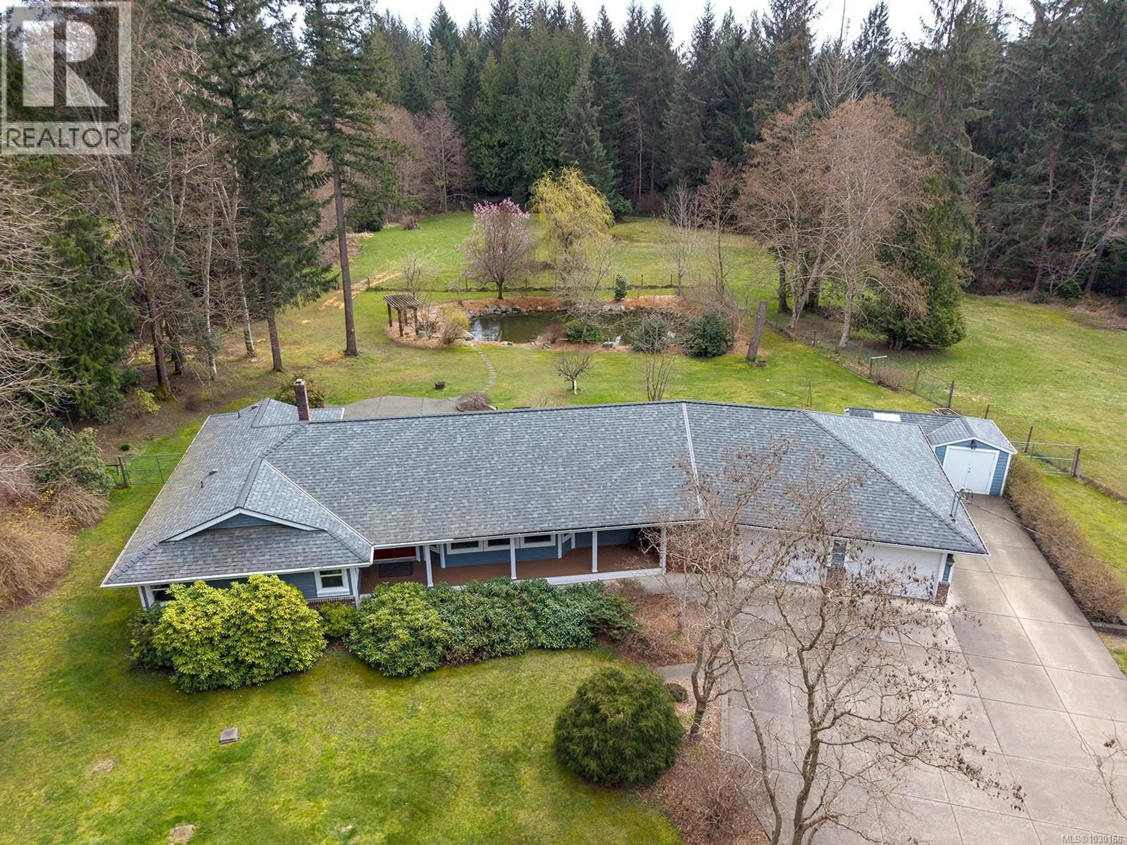 A pic from outside/outdoor area/front of a property/back of a property/a pic from drone, unknown for 2495 HUBAND ROAD, Courtenay British Columbia V9J1L6
