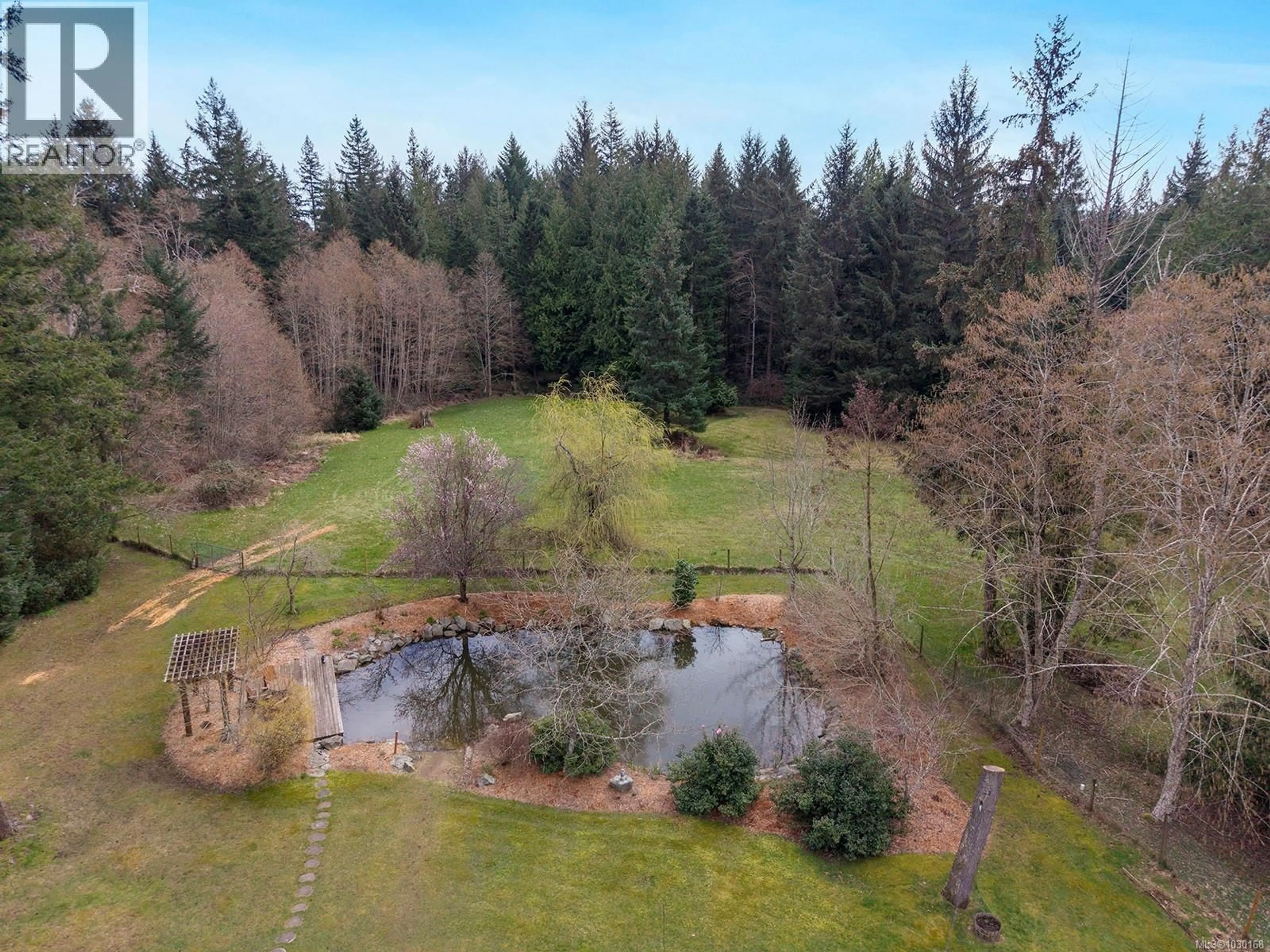 A pic from outside/outdoor area/front of a property/back of a property/a pic from drone, forest/trees view for 2495 HUBAND ROAD, Courtenay British Columbia V9J1L6