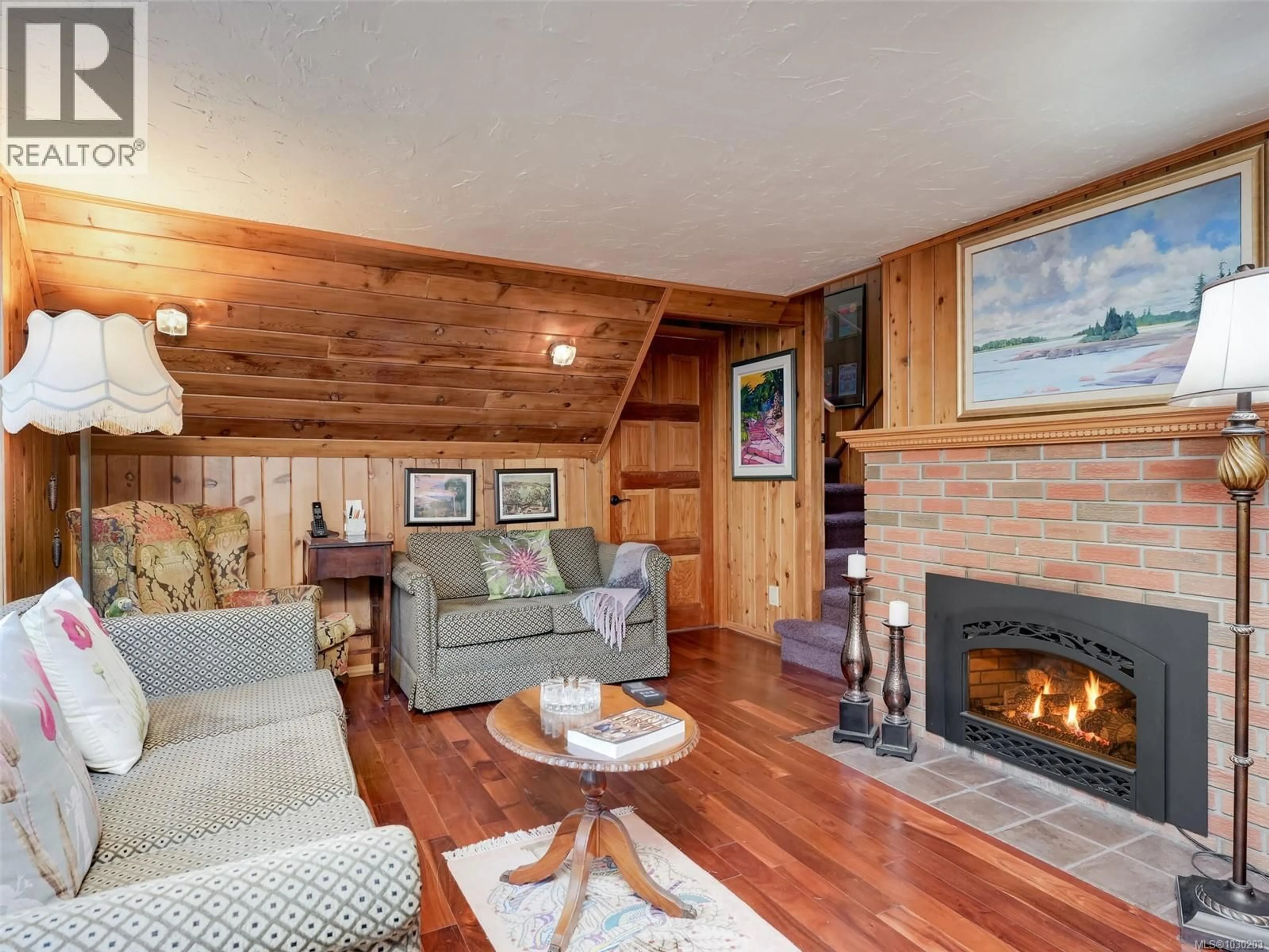 Living room with furniture, wood/laminate floor for 3781 PHILLIPS ROAD, Sooke British Columbia V9Z0Y3