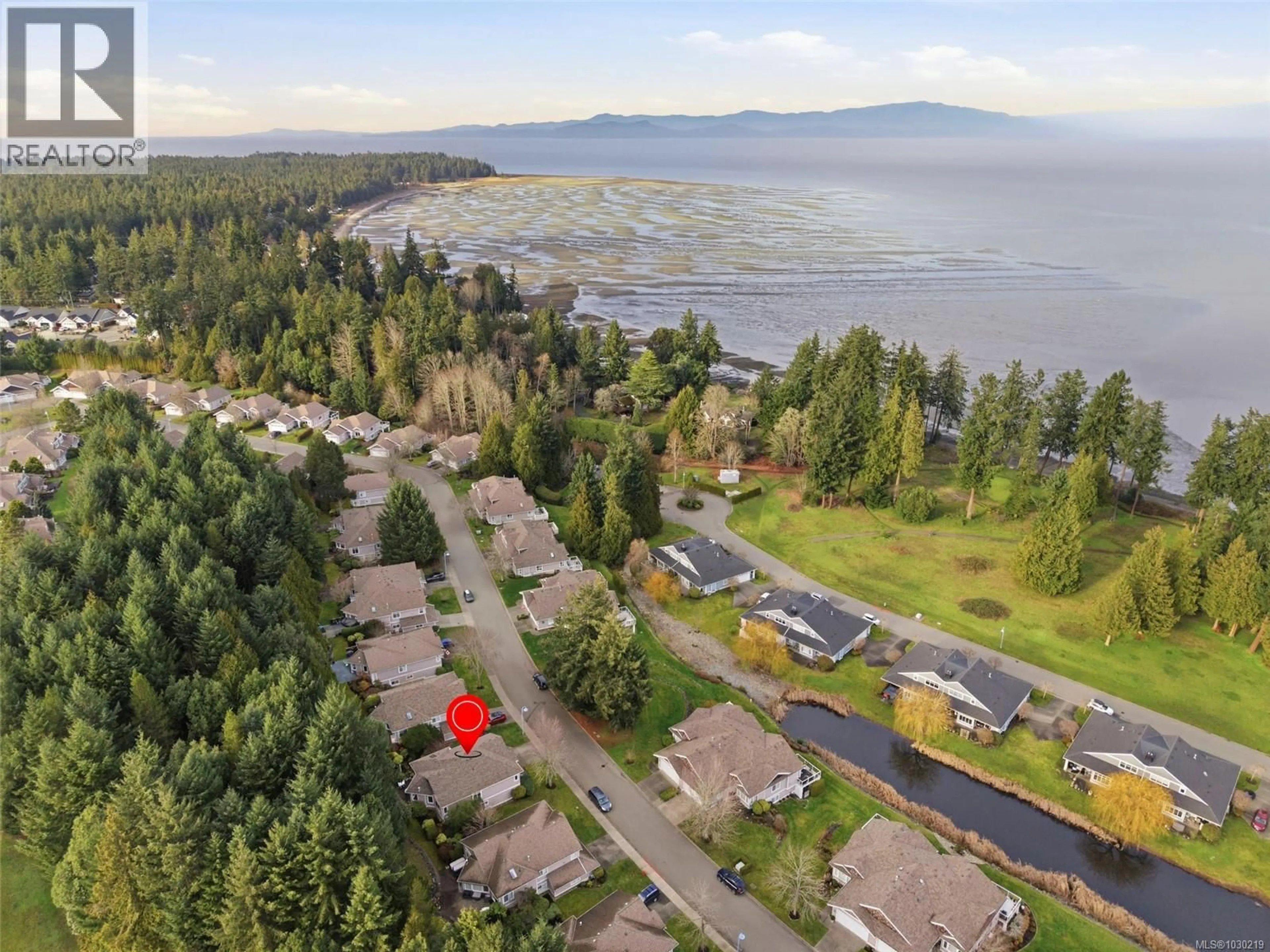 A pic from outside/outdoor area/front of a property/back of a property/a pic from drone, water/lake/river/ocean view for 1266 SATURNA DRIVE, Parksville British Columbia V9P2X6