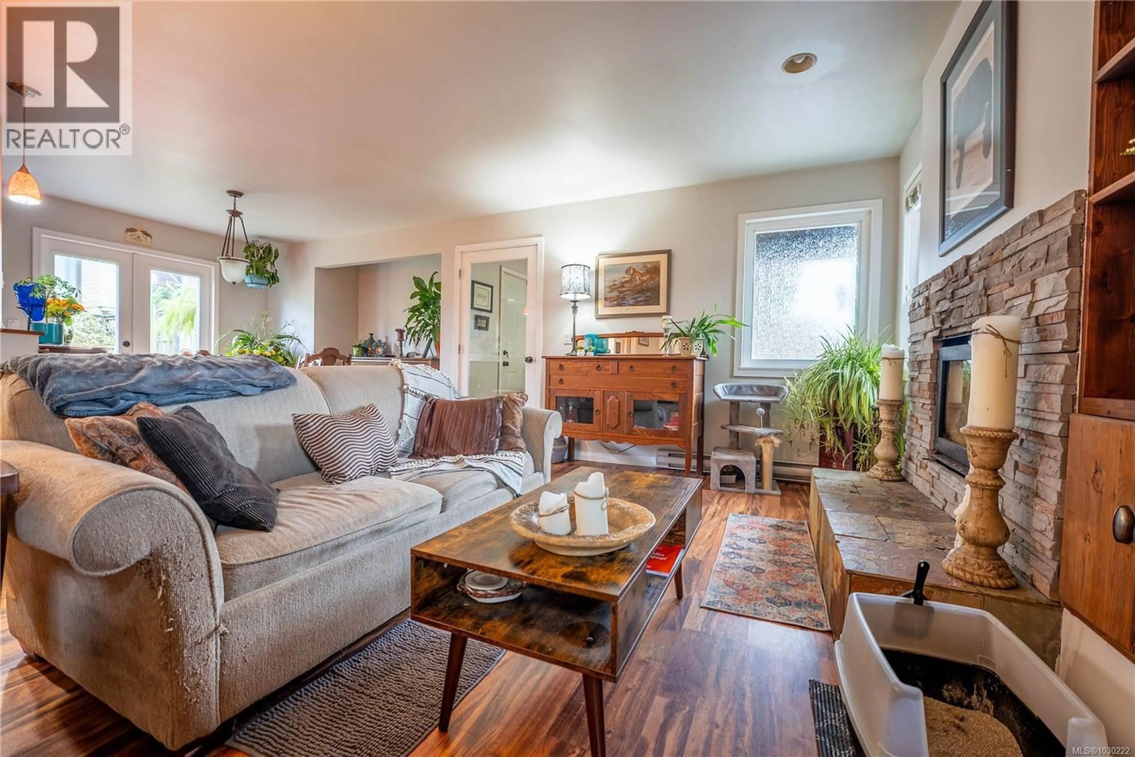 Living room with furniture, wood/laminate floor for 9960 SWIFTSURE PLACE, Sidney British Columbia V8L4E4