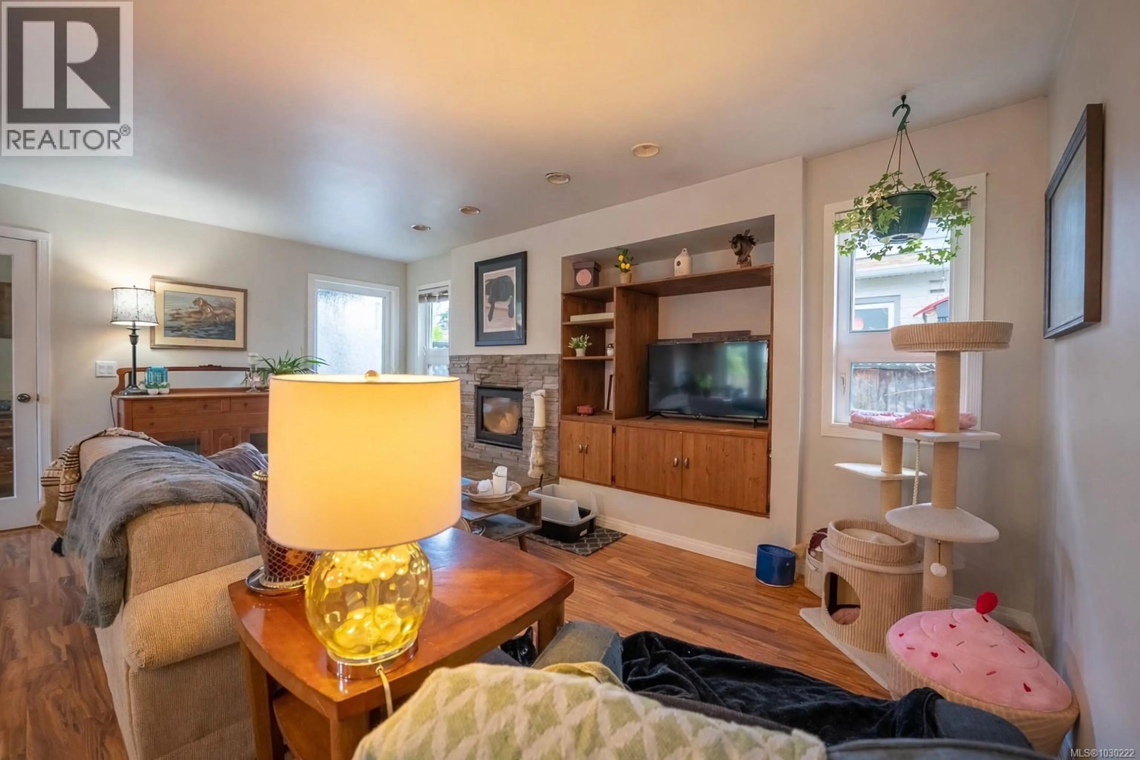 Living room with furniture, wood/laminate floor for 9960 SWIFTSURE PLACE, Sidney British Columbia V8L4E4