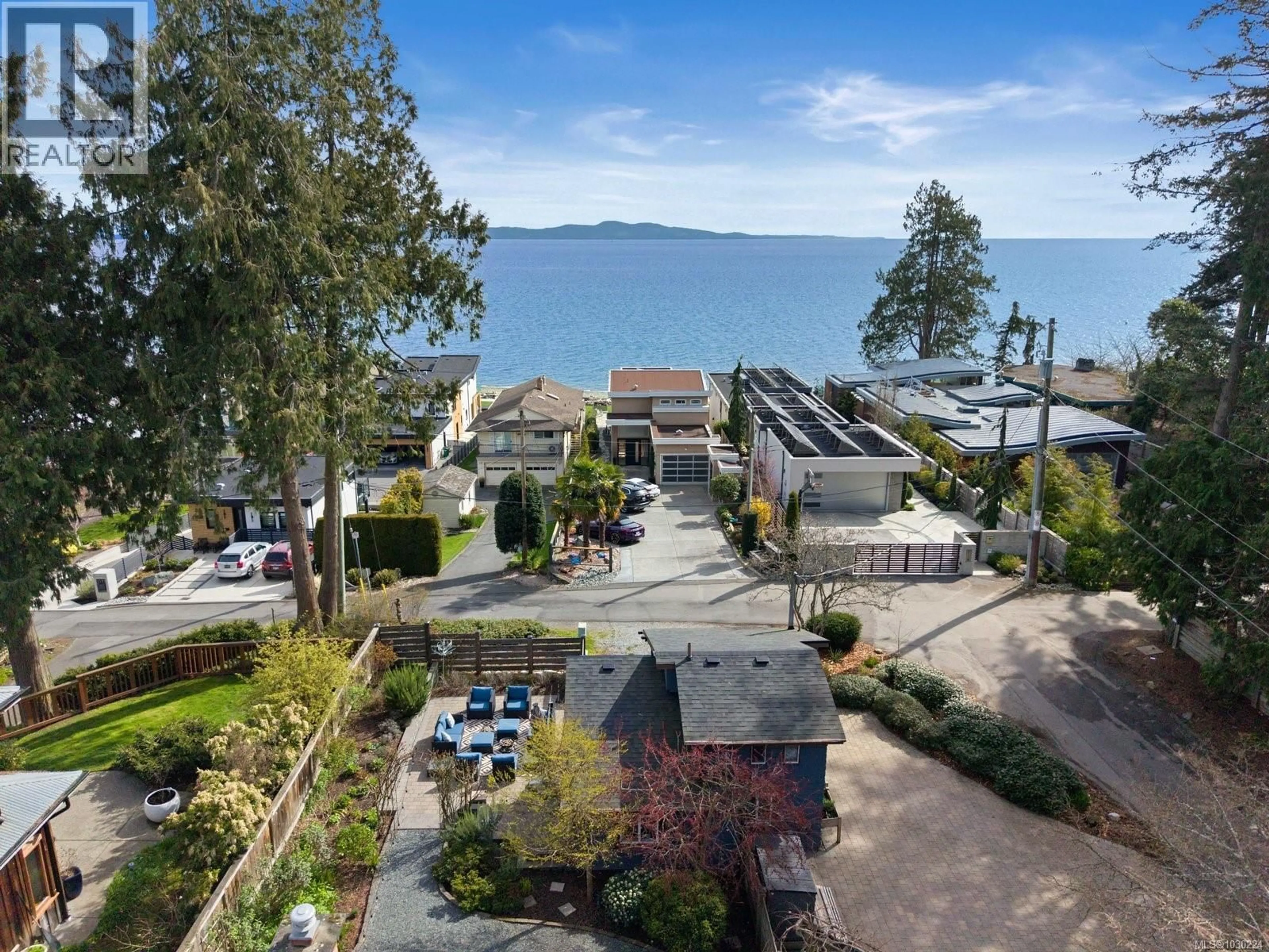 A pic from outside/outdoor area/front of a property/back of a property/a pic from drone, water/lake/river/ocean view for 5165 CORDOVA BAY ROAD, Saanich British Columbia V8Y2K7