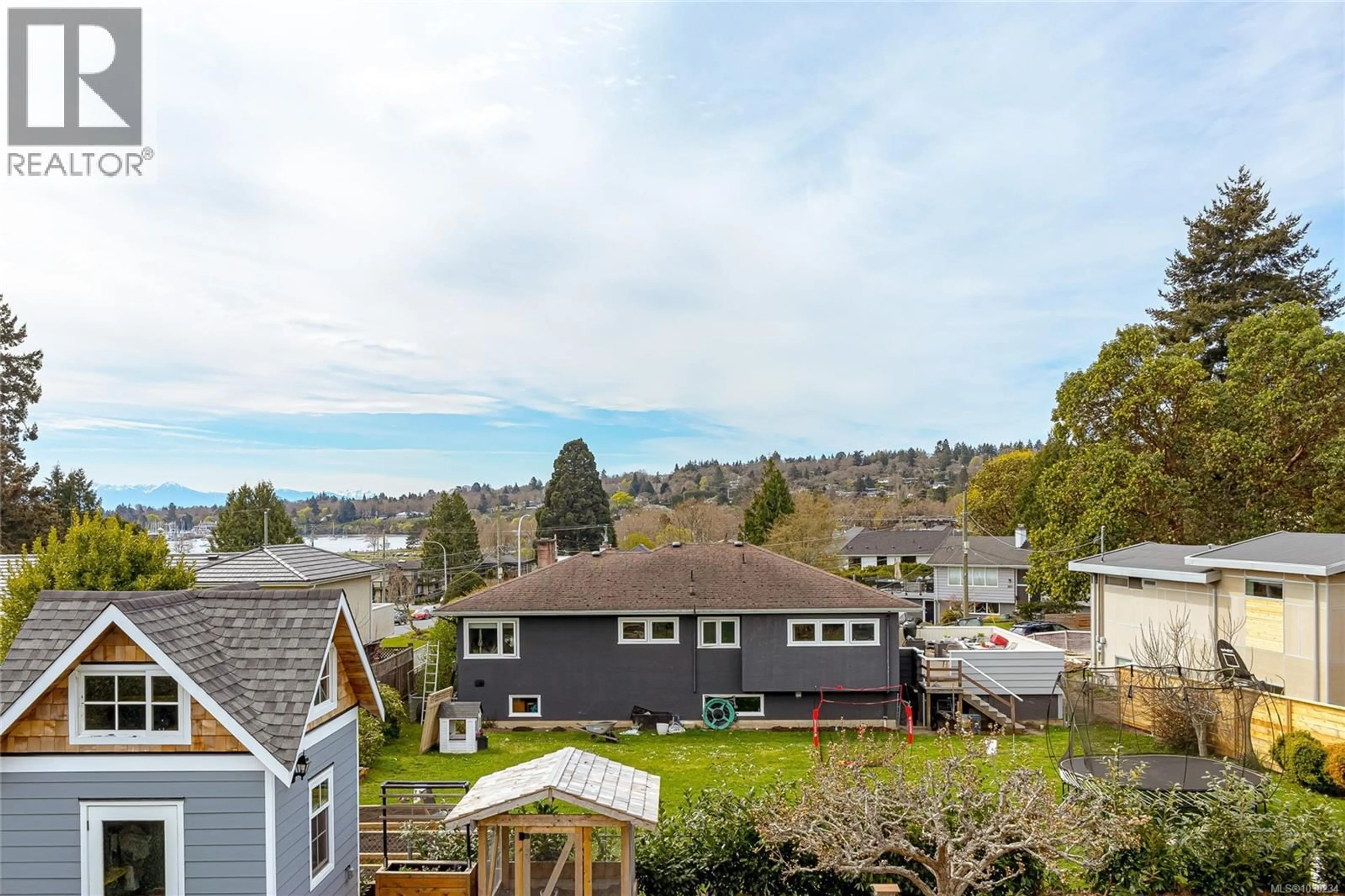 A pic from outside/outdoor area/front of a property/back of a property/a pic from drone, mountain view for 3960 CHERRILEE CRESCENT, Saanich British Columbia V8N1R9