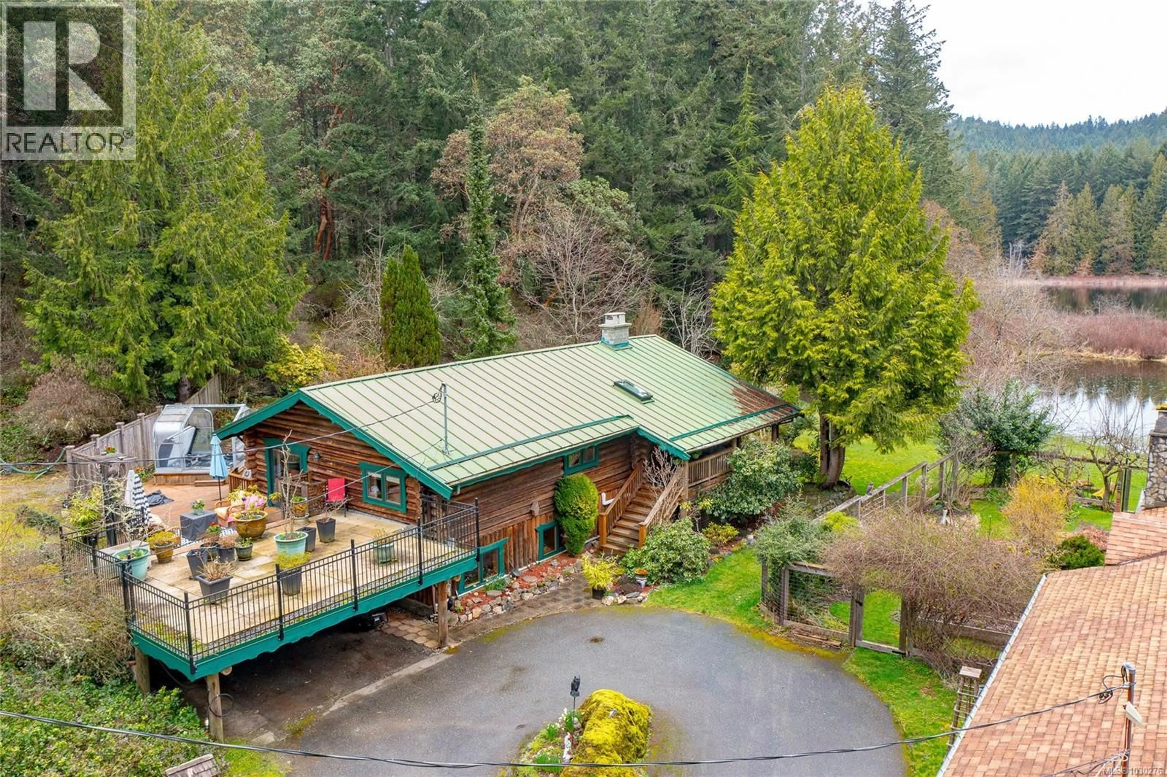 A pic from outside/outdoor area/front of a property/back of a property/a pic from drone, forest/trees view for 5230 MUNN ROAD, Highlands British Columbia V9E1G8