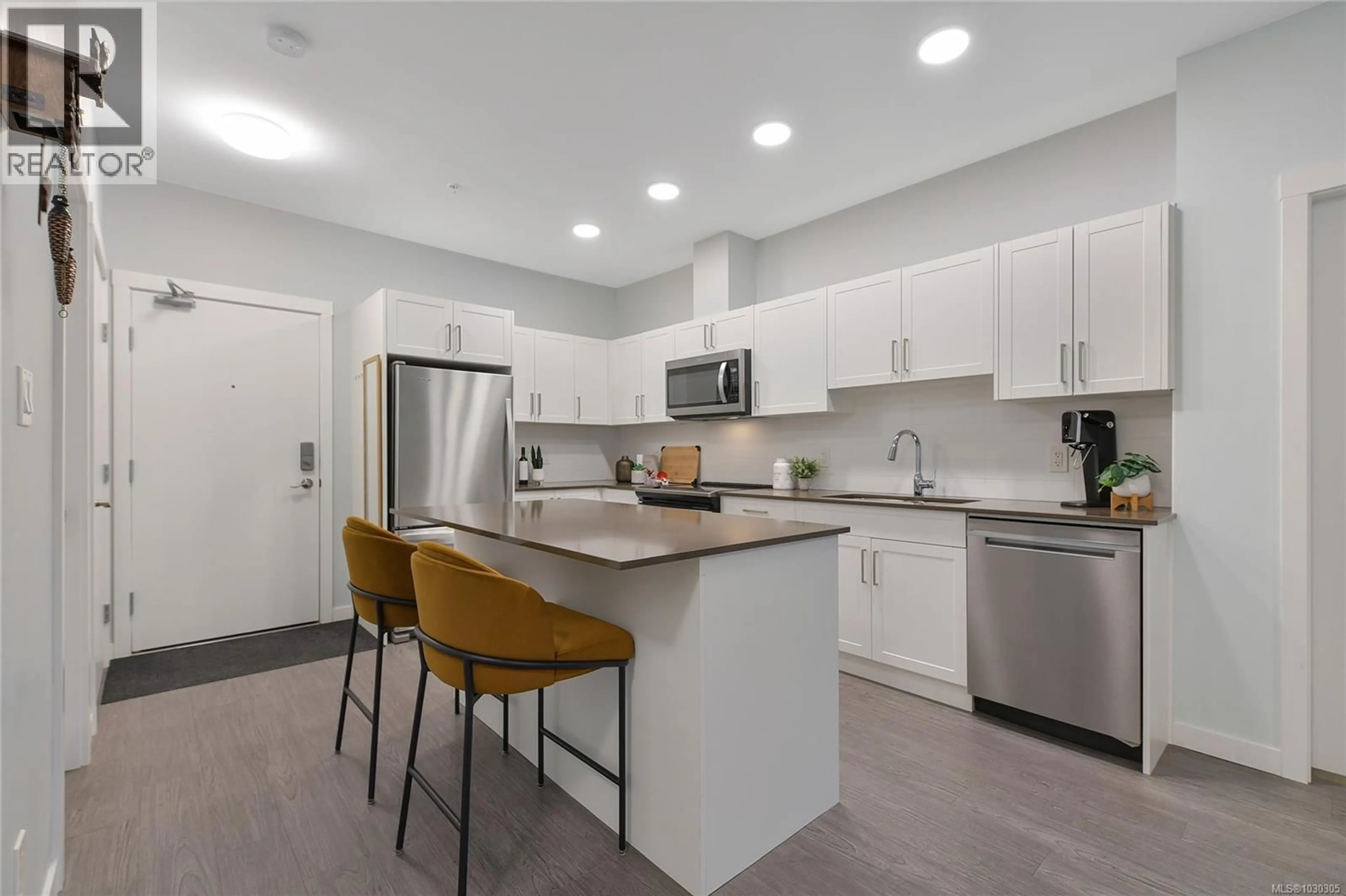 Open concept kitchen, ceramic/tile floor for 406 - 2843 JACKLIN ROAD, Langford British Columbia V9B4P4