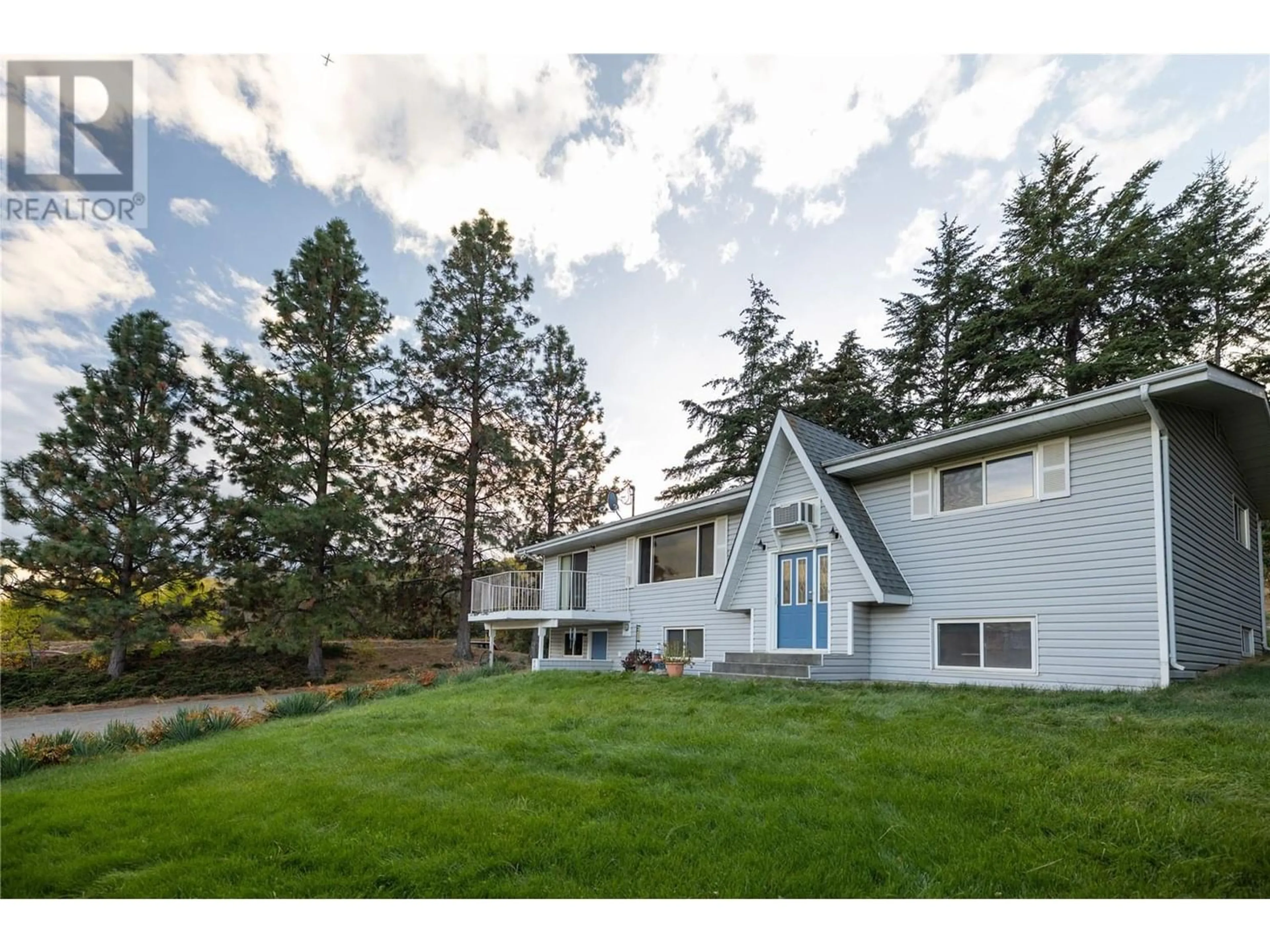 Frontside or backside of a home, the fenced backyard for 10750 Highway 97 Highway, Lake Country British Columbia V4V1V3